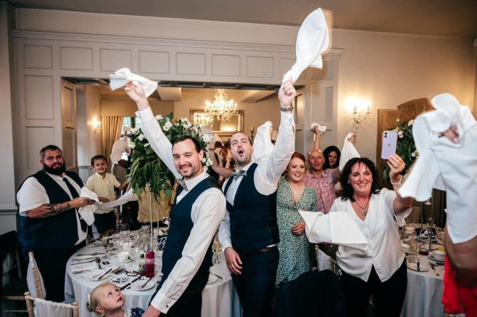 Guests waving their napkins as the newly married couple are announced to make fantastic, fun photo opportunities