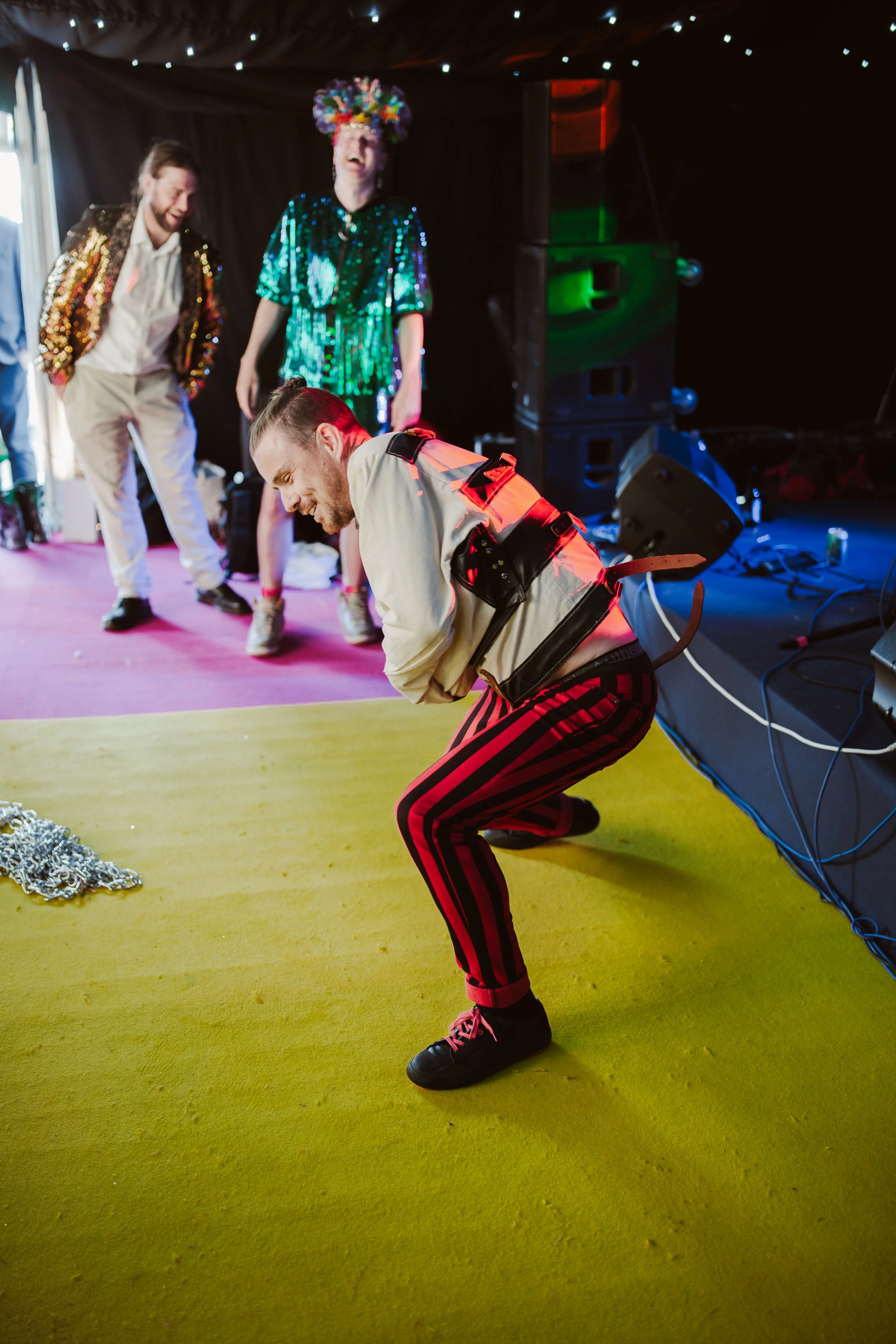 Just Saul entertaining guests at a colorful themed party