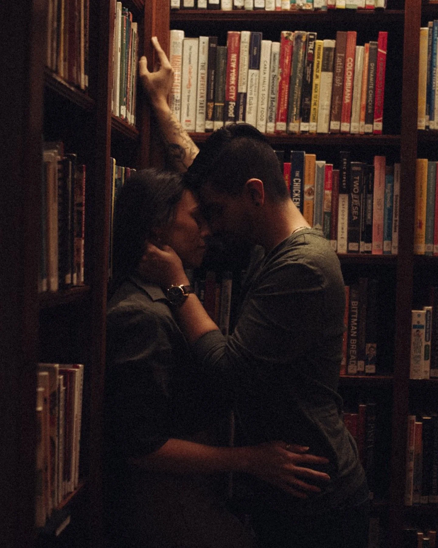 Love Between the Pages 📚 
There’s something magical about capturing love in a library—the quiet moments, the soft light filtering through the stacks, the way two people can get completely lost in each other surrounded by thousands of st
