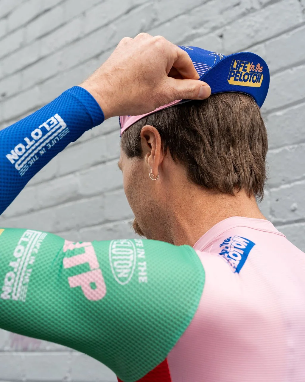 To wear it backwards - Hold the cap by the brim, pull it on from front, adjust peak and leave at least 1 finger of luft.