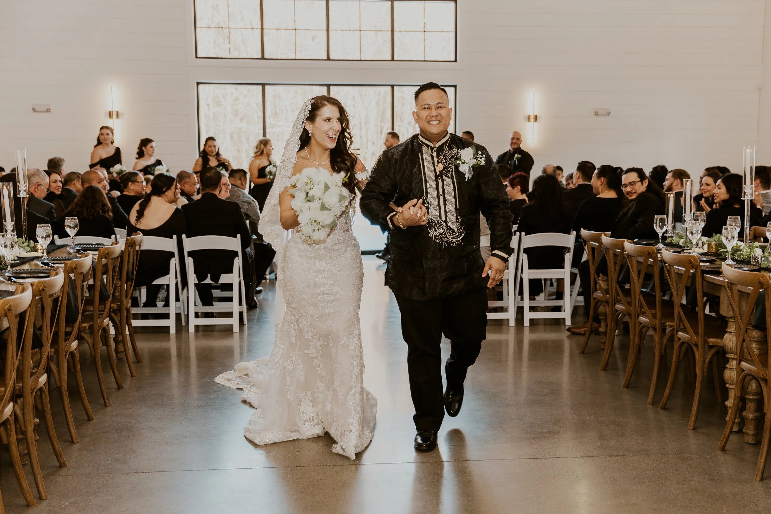 Couple walking down the indoor aisle.
