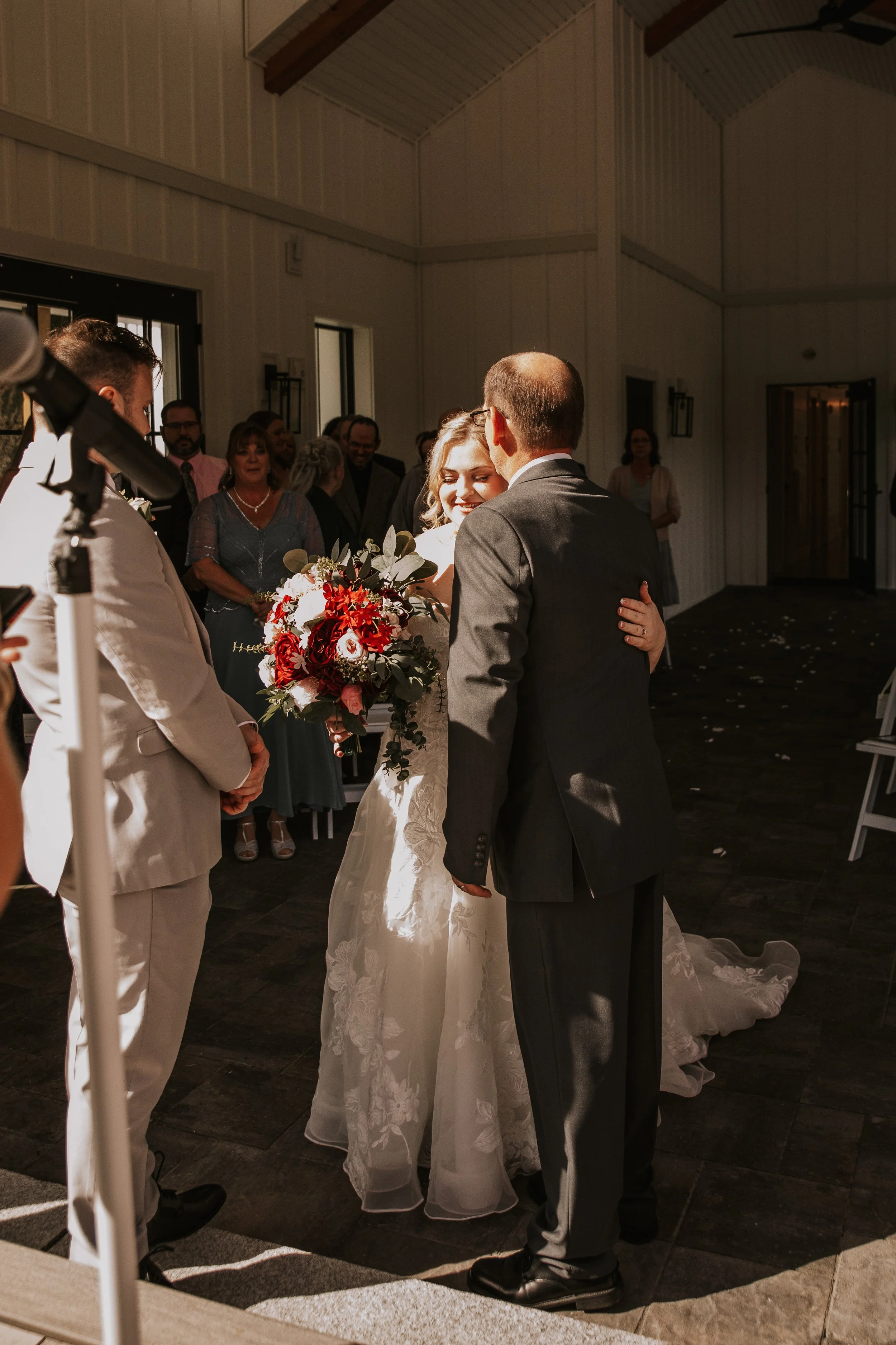 Embrace at the end of the aisle.