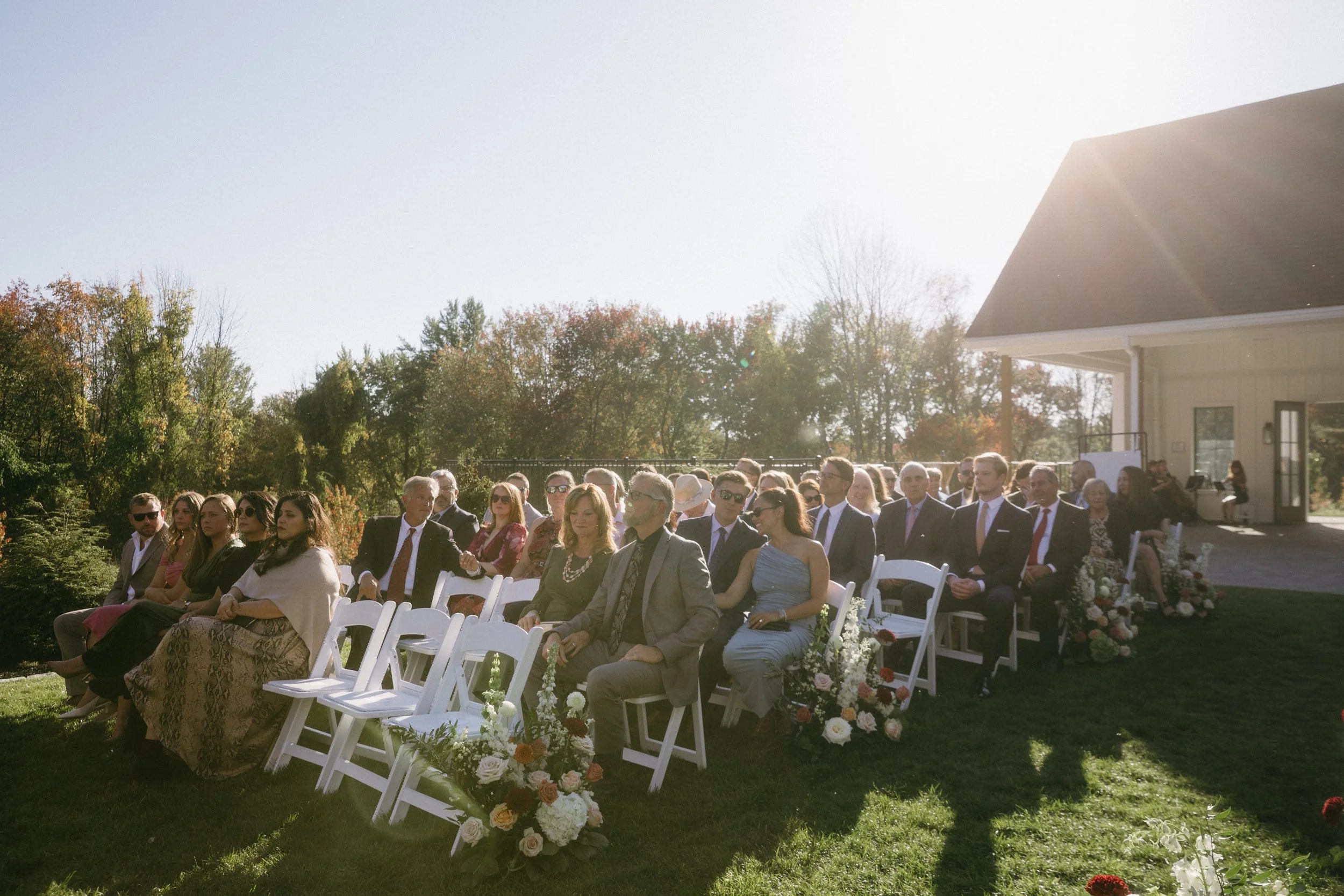 View of guests on the Middle Lawn facing the back woods during ceremony. 
