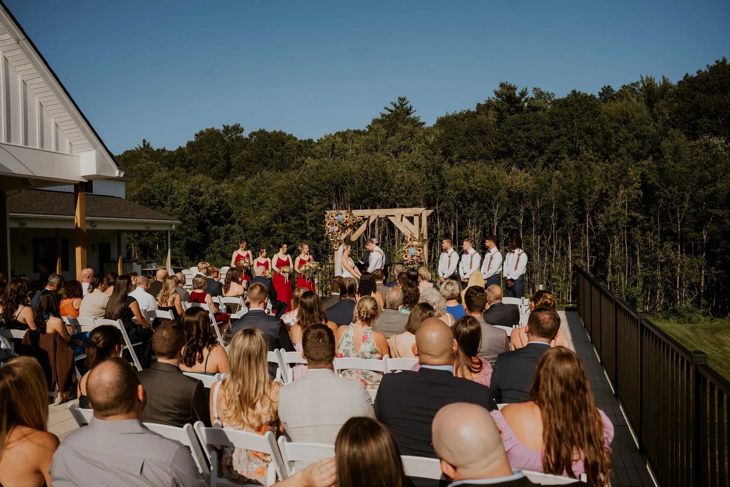 View from back right of wedding ceremony on Roof Top Deck facing the back woods.