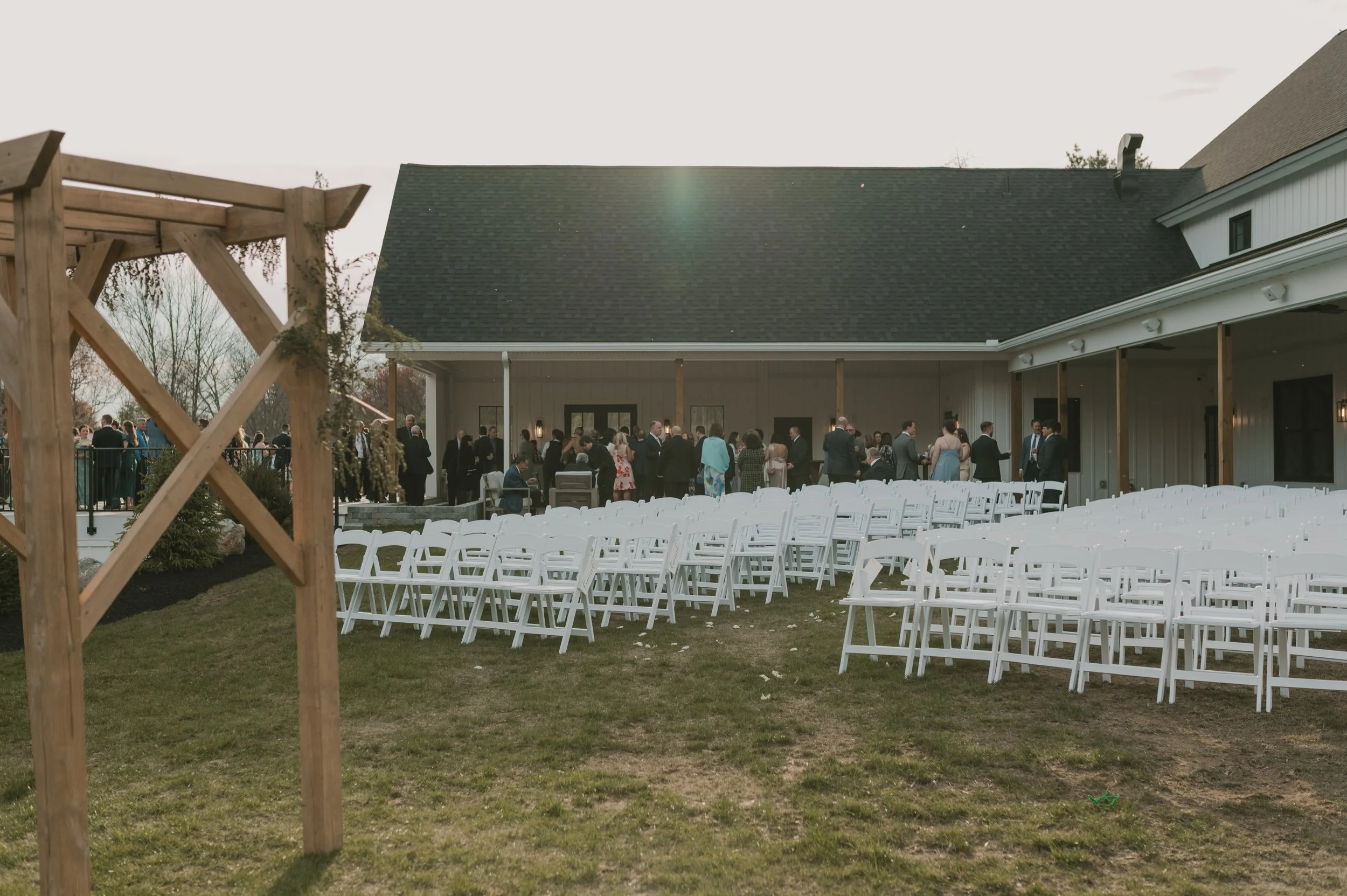 Pre-ceremony view of seating for guests on the Middle Lawn, facing the Covered Breezeway and Covered Porch. 