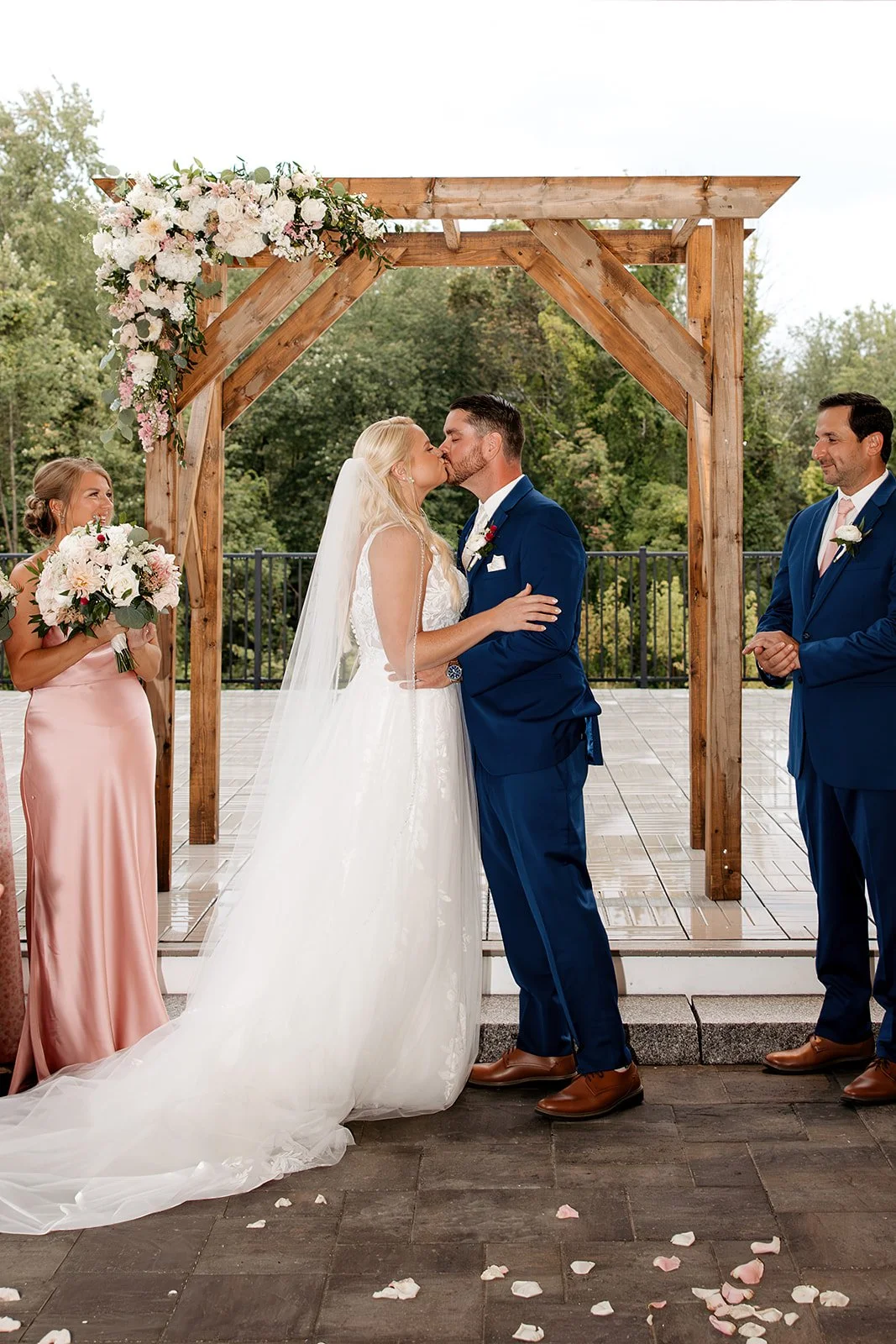 Wedding ceremony located under the Covered Breezeway facing the Roof Top Deck and pond. 