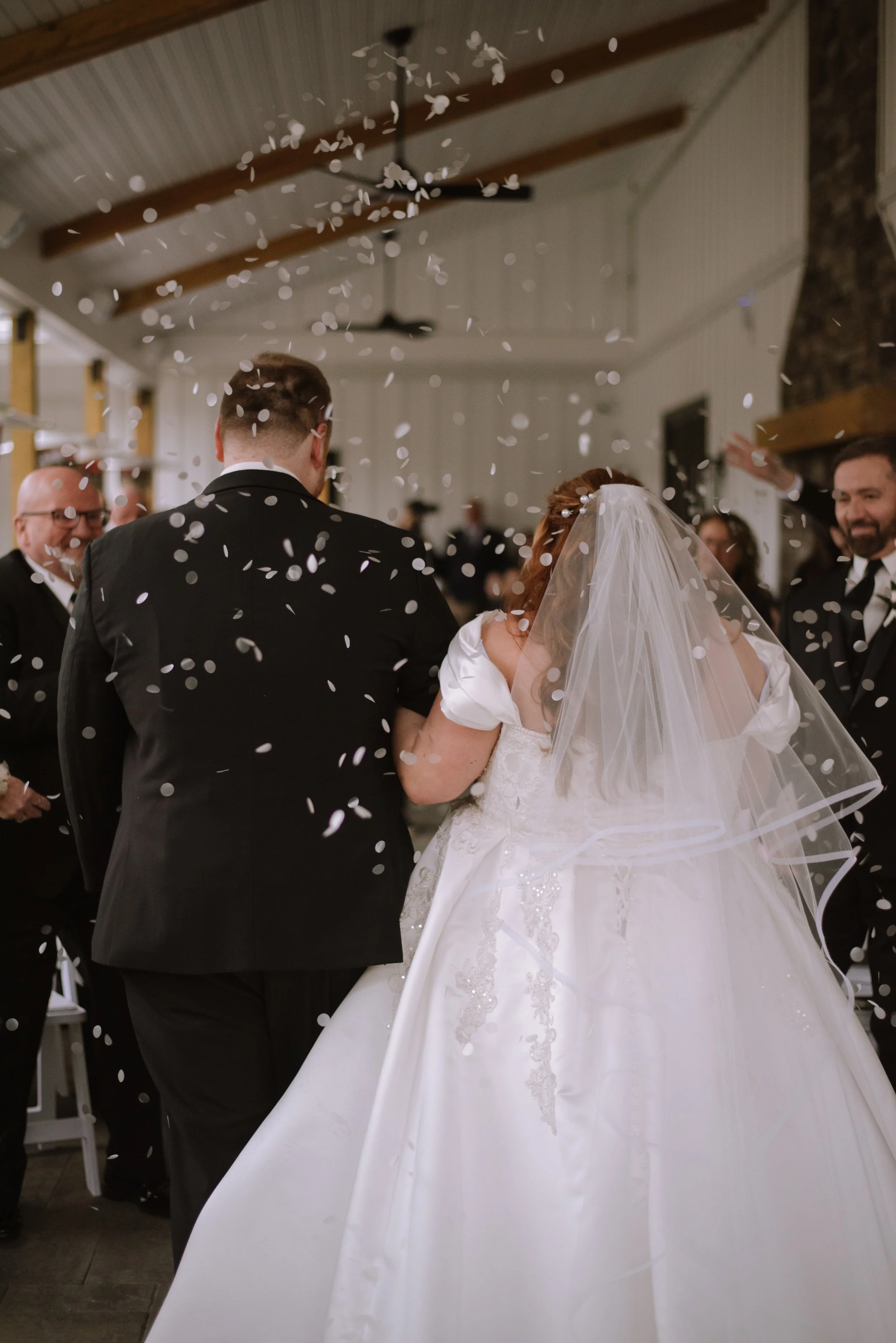 End of wedding ceremony located under the Long Covered Porch.