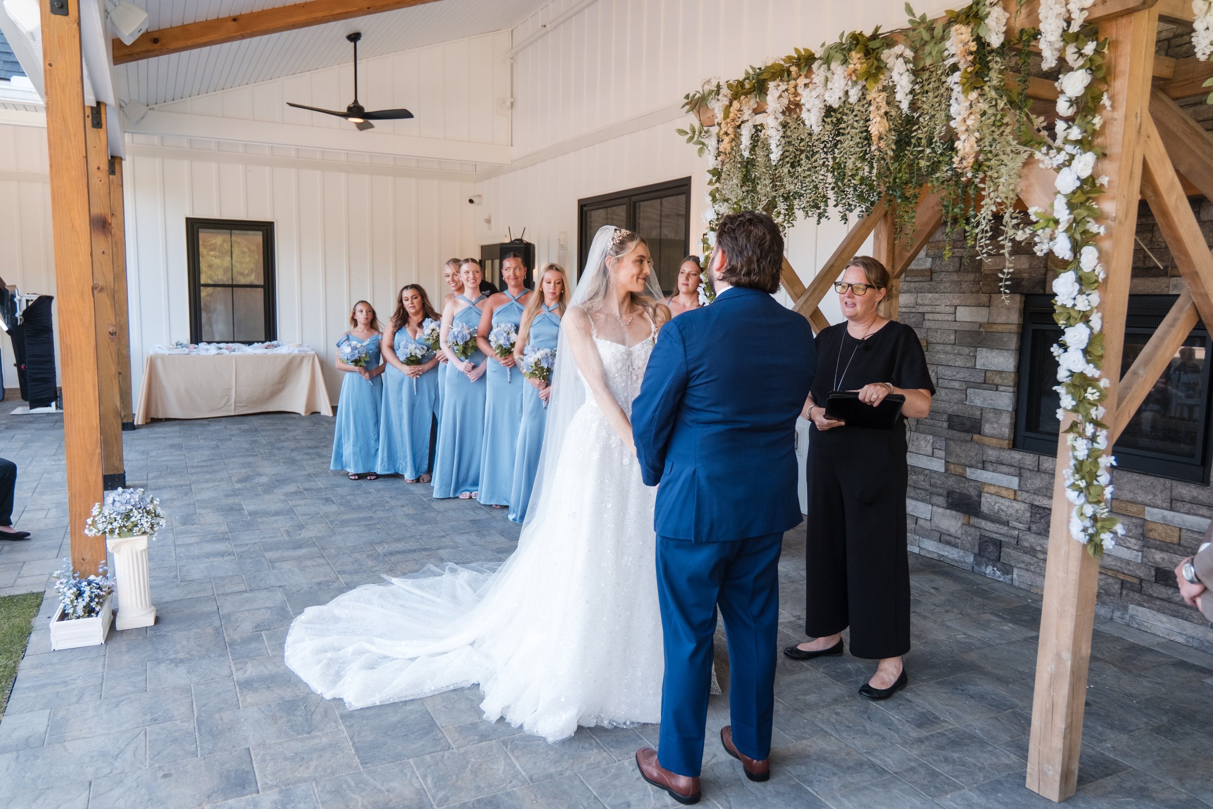 View from front right side guest seating of wedding ceremony facing the fireplace. 