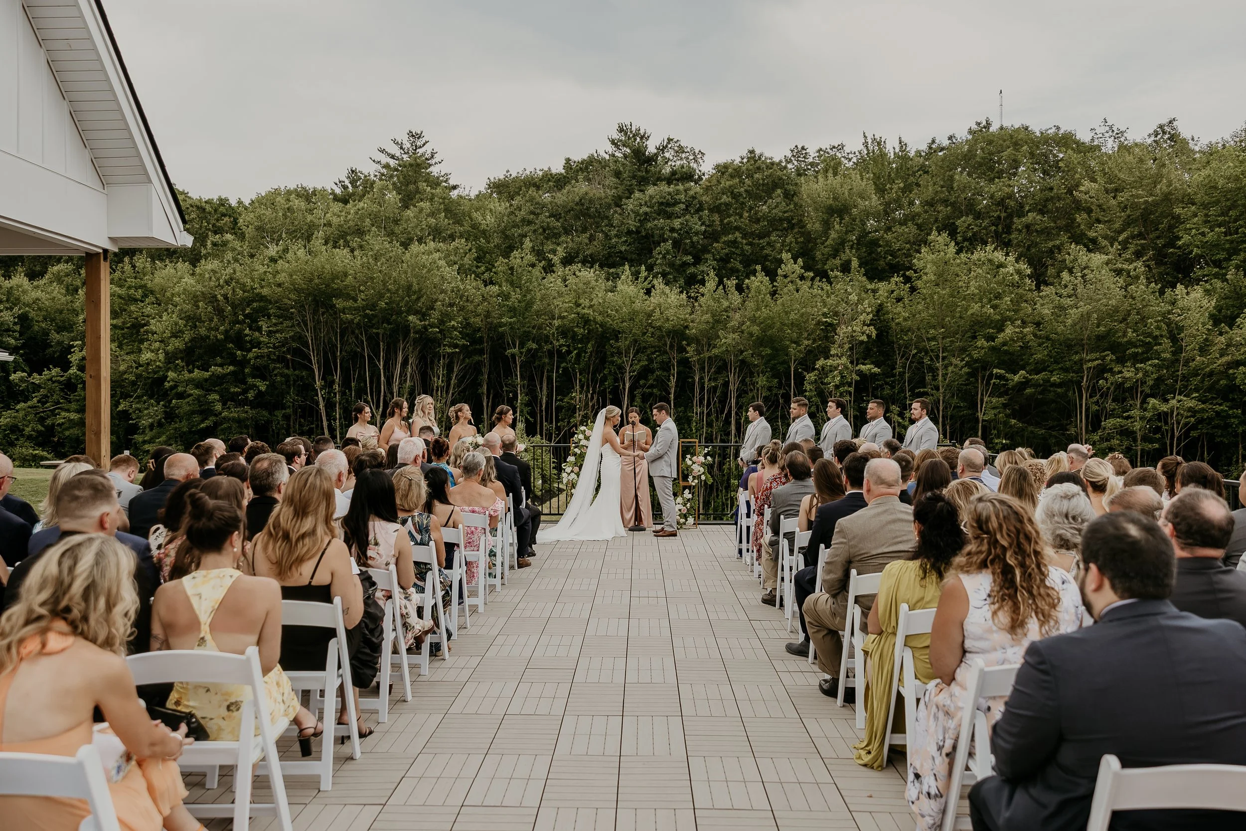 Wedding ceremony located on the Roof Top Deck, view from the back row.