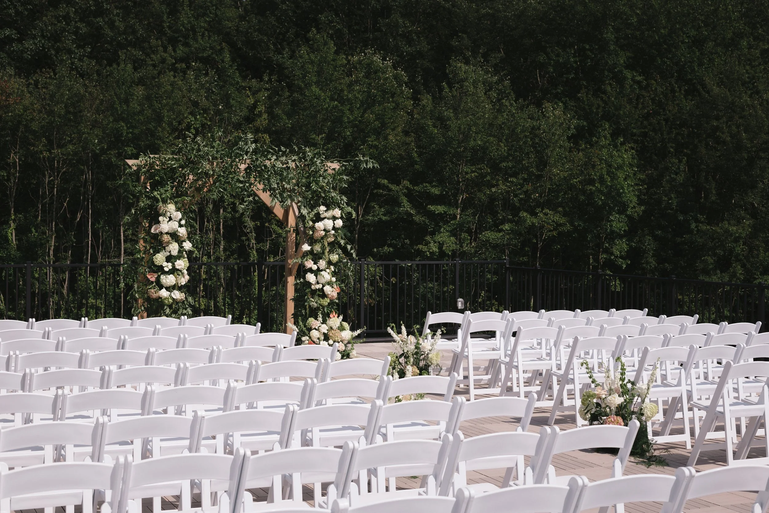 View of pre-ceremony seating facing the back woods.
