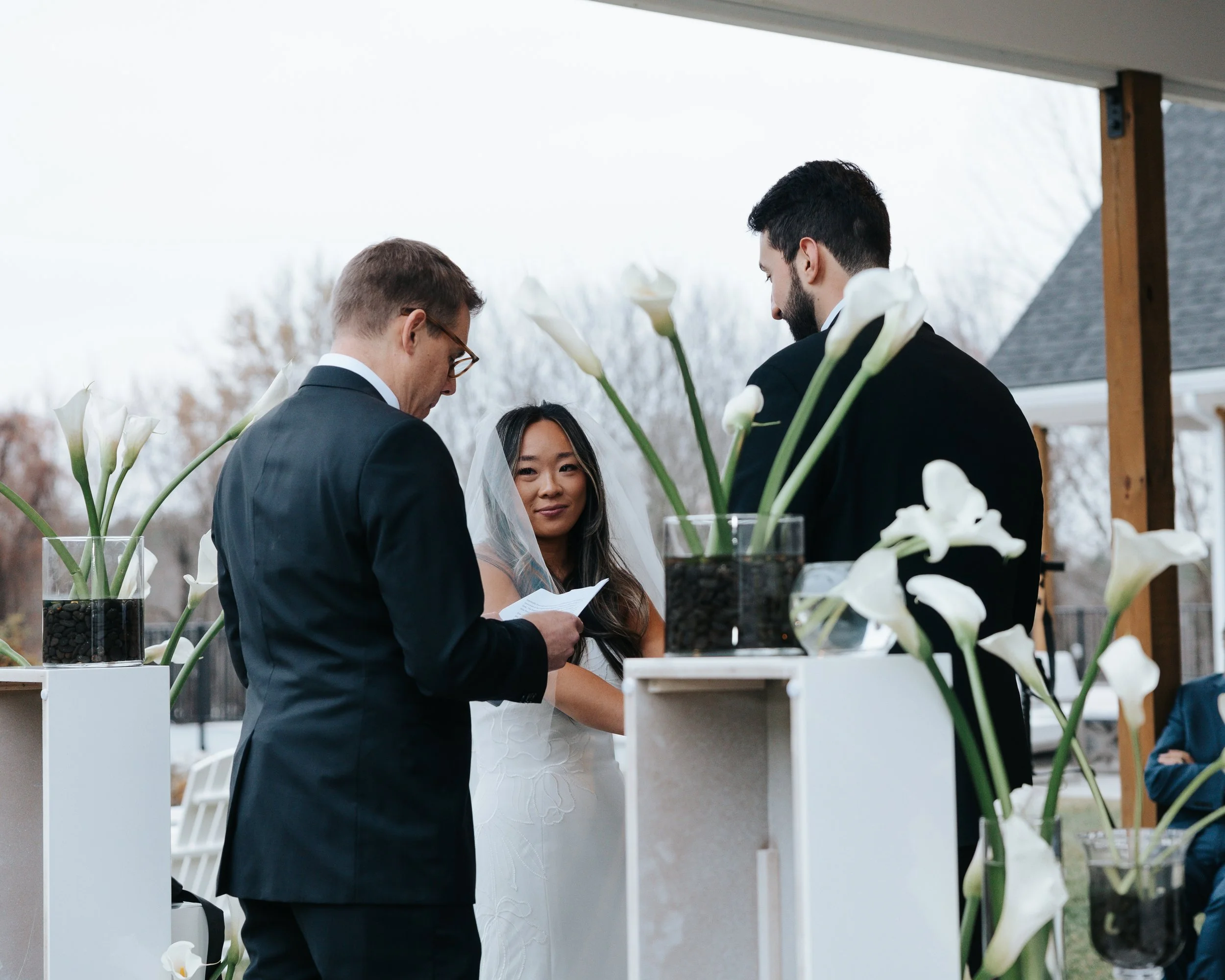 View from the Back Lawn of wedding ceremony bride and groom. 