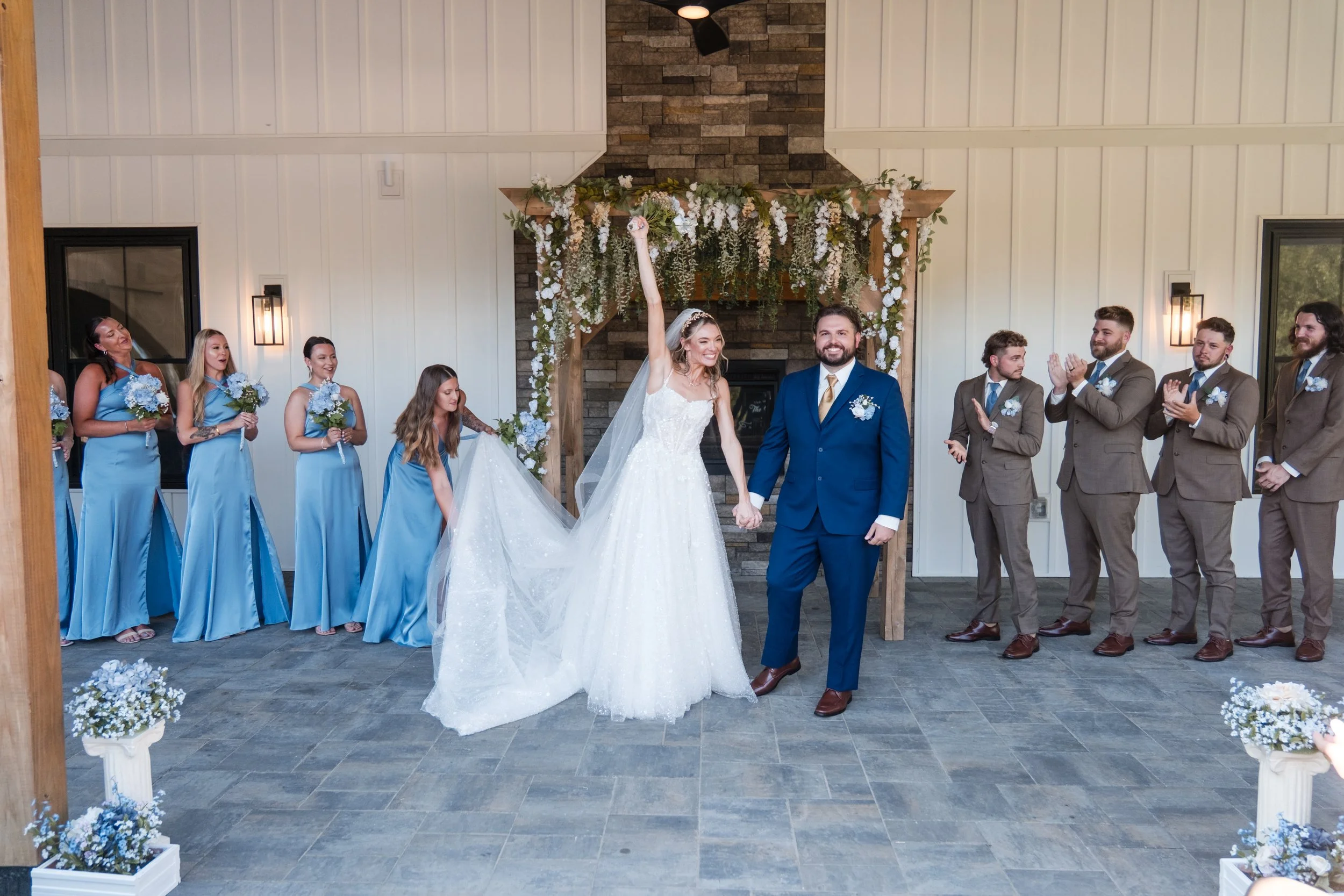 End of wedding ceremony located under the Long Covered Porch facing the fireplace. 