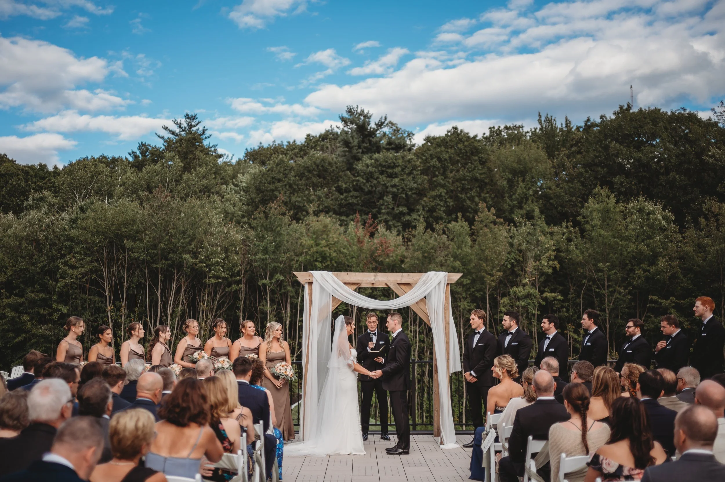 Wedding ceremony located on the Roof Top Deck, view from the back row.