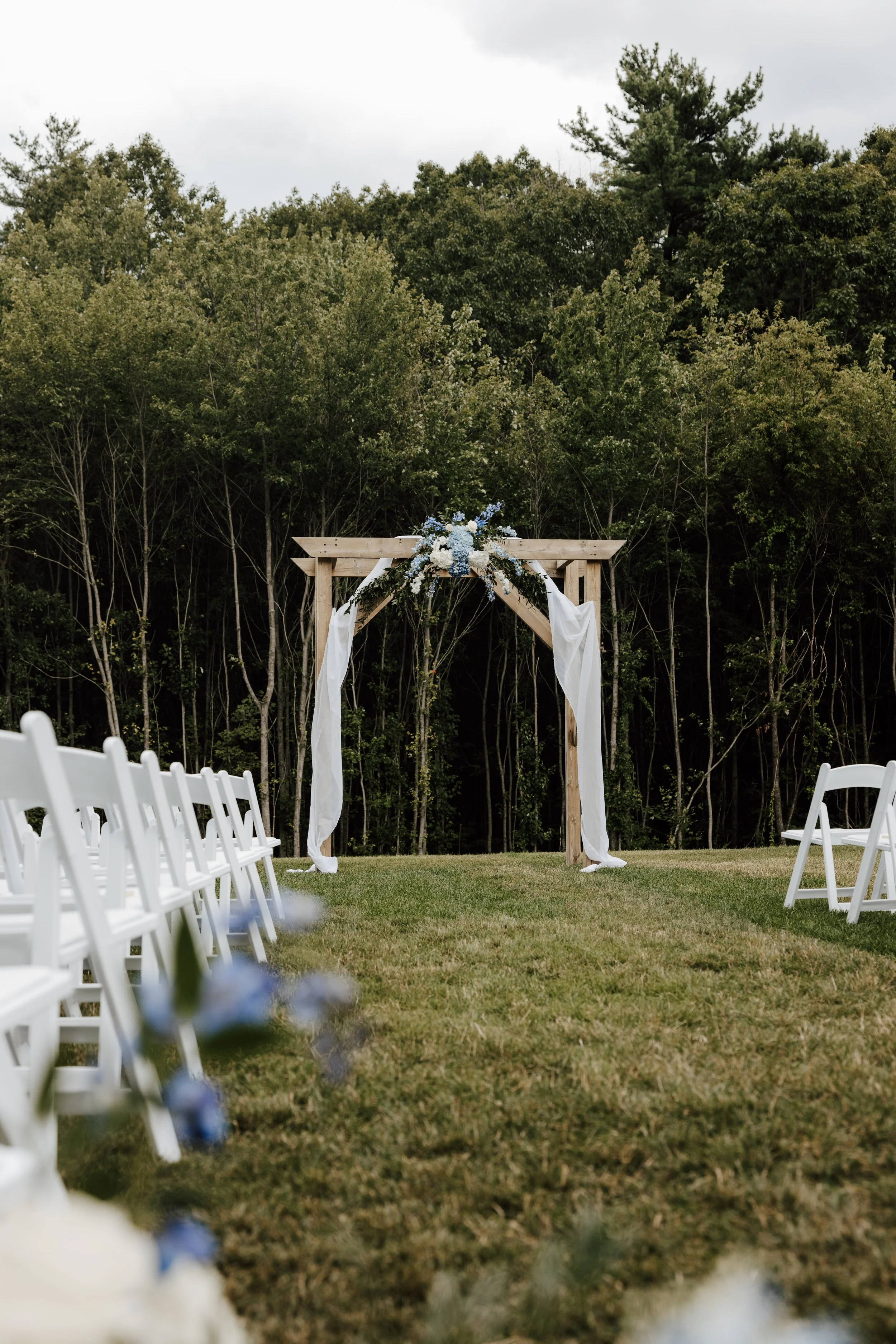 Pre-ceremony view of Middle Lawn wedding facing the back woods. 