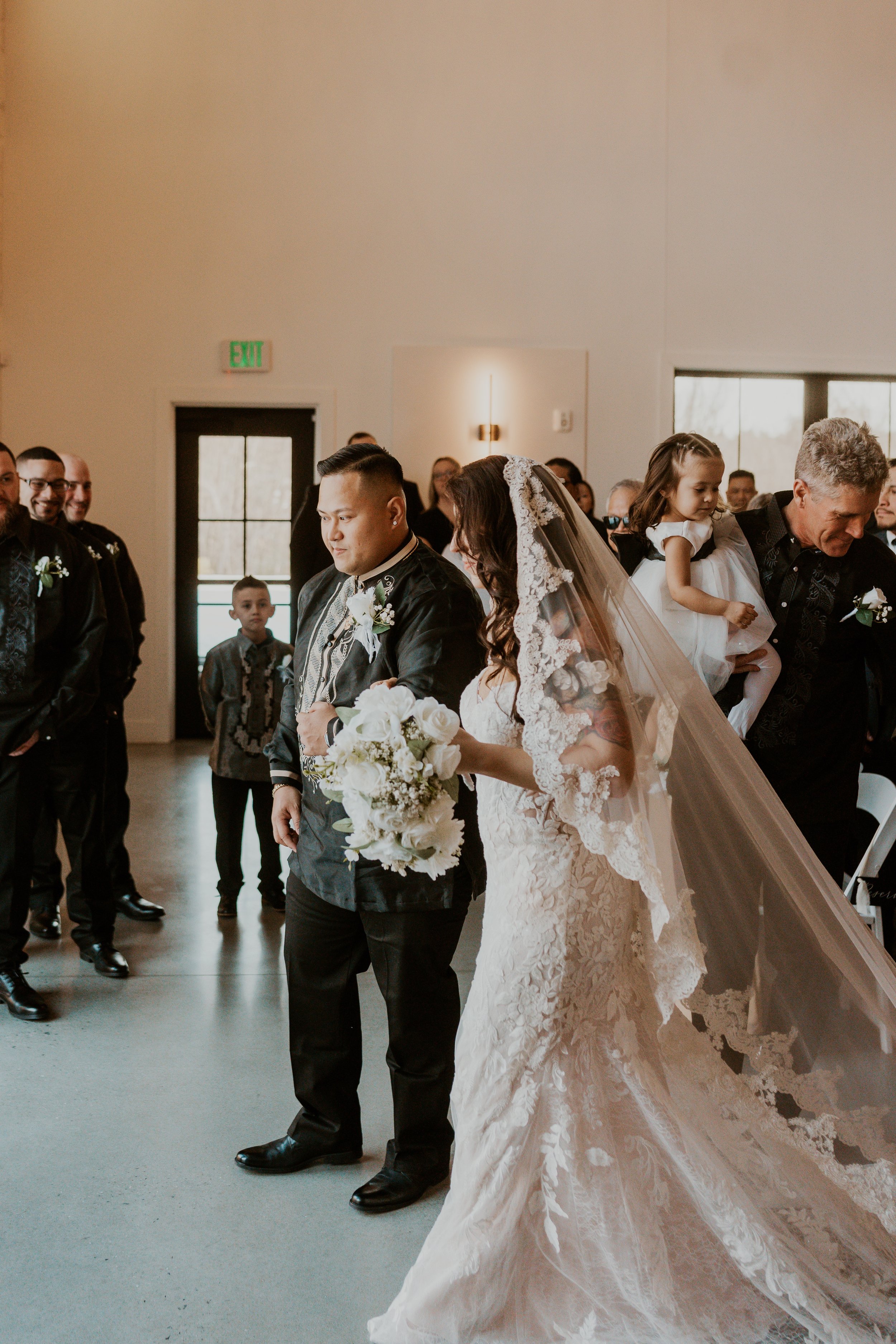 Meeting at the end of the aisle.