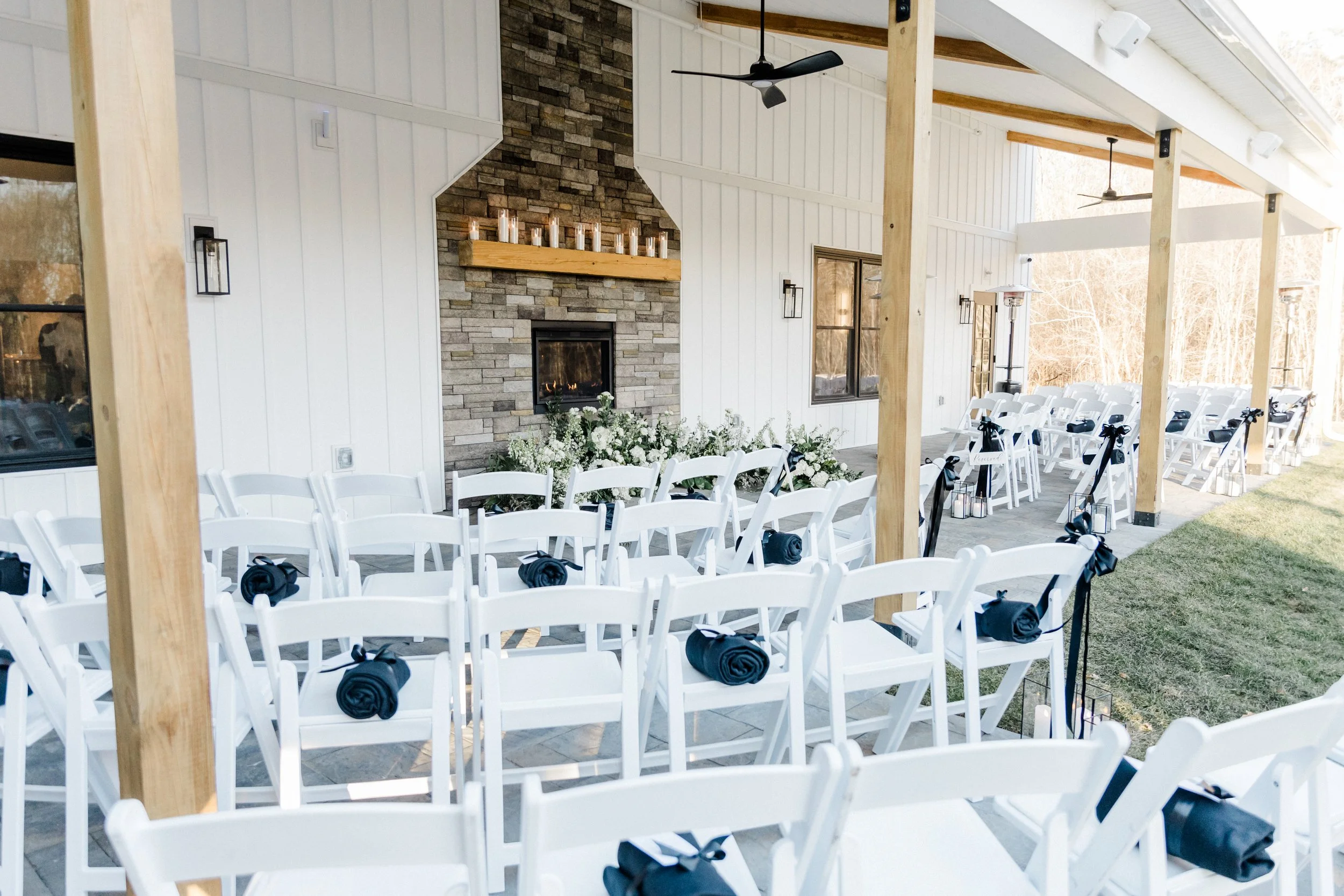 View of pre-ceremony guest seating facing the fireplace under the Long Covered Porch.