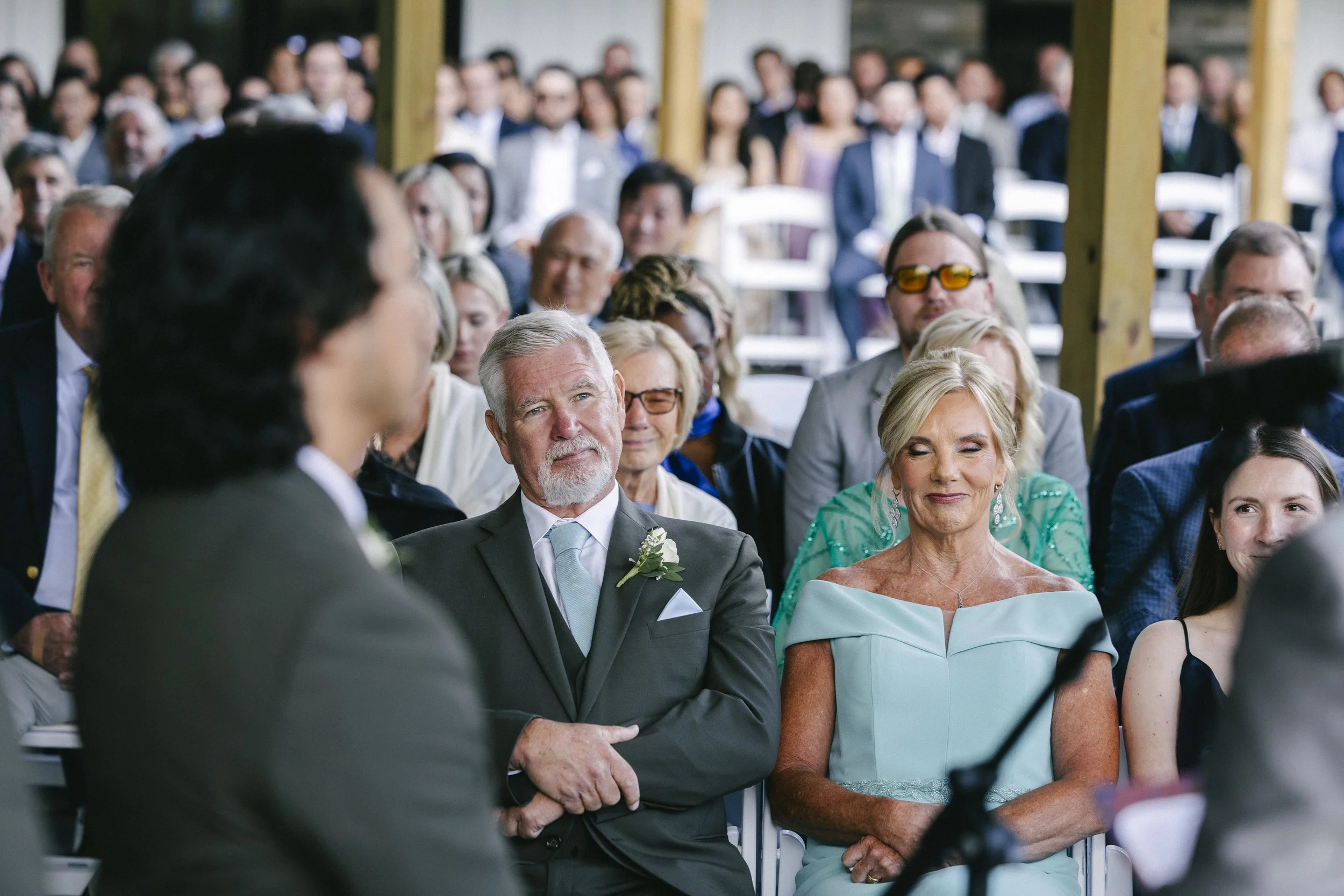 View of guests under the Covered Breezeway facing the bride and groom on Roof Top Deck.