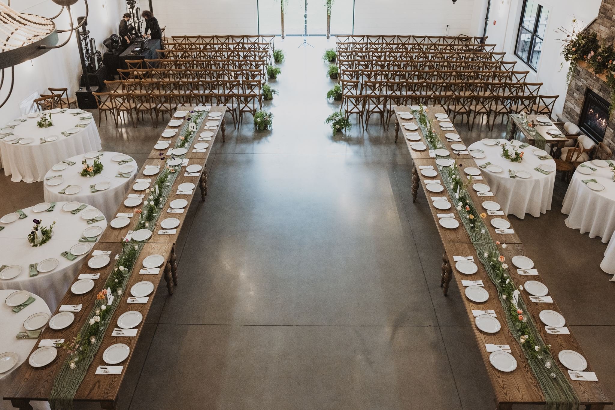 View of ceremony space from upstairs suite balcony; featuring reception layout for ceremony. 