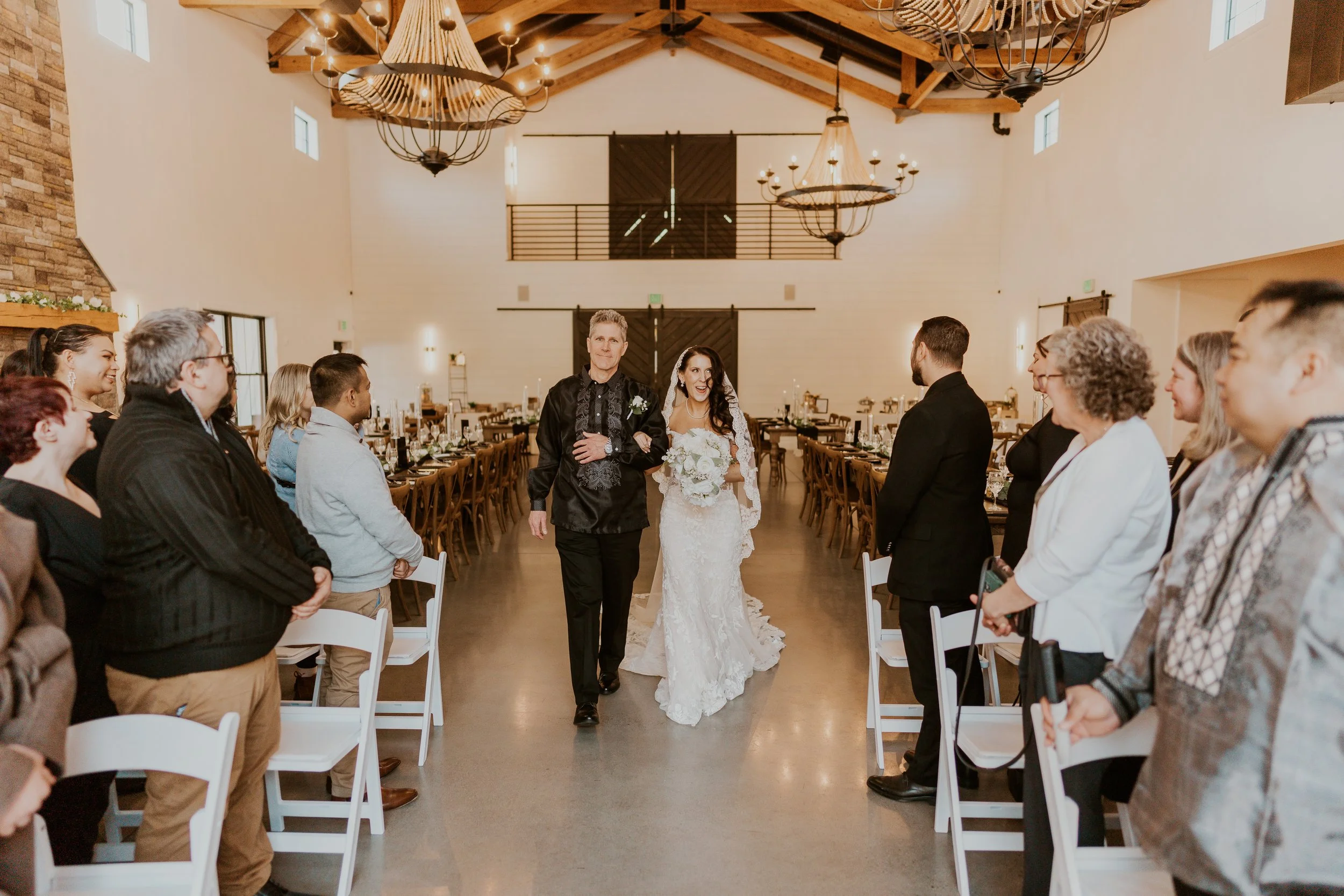 Father and daughter walking down the aisle.