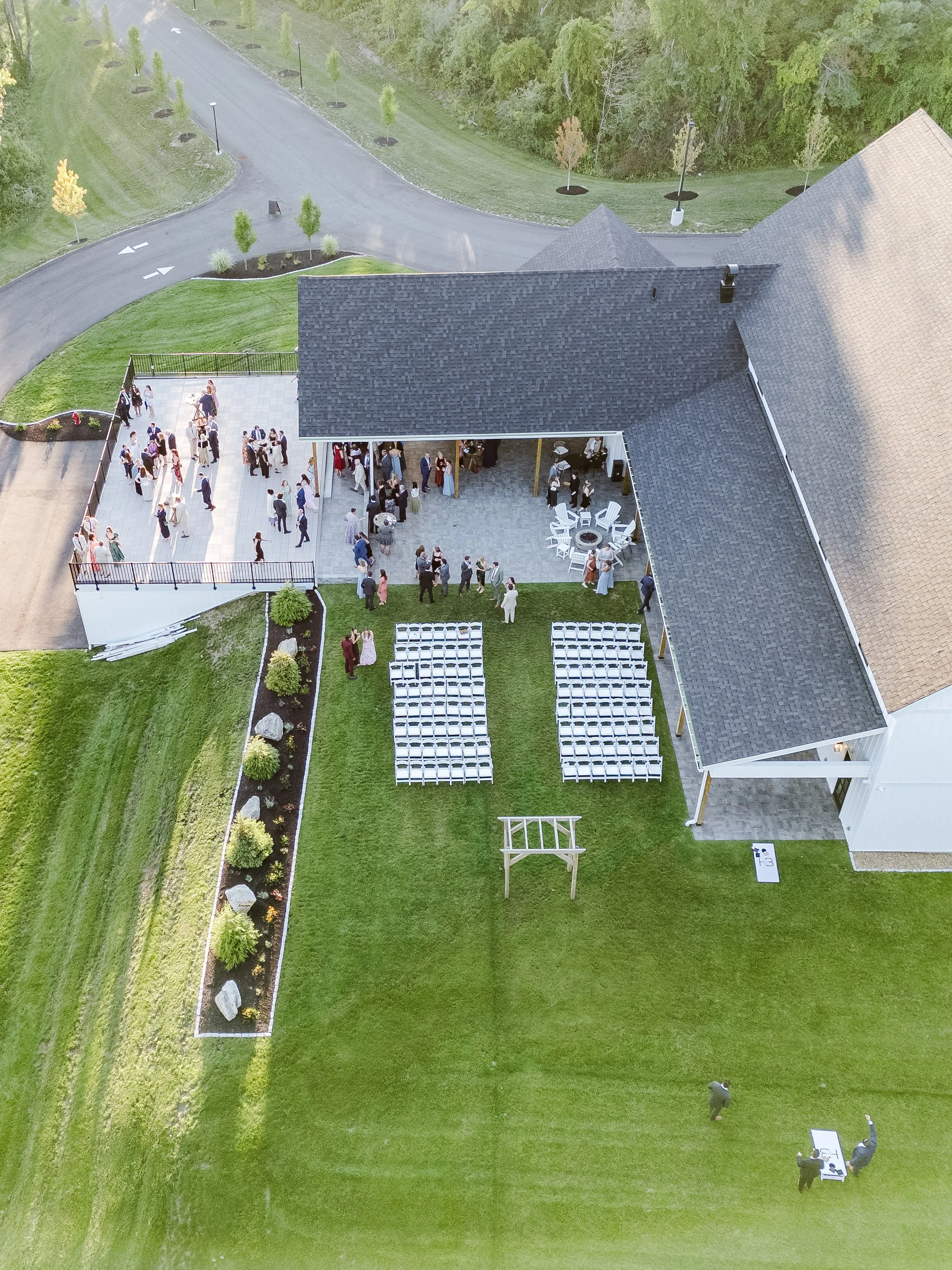 View of Middle Lawn wedding ceremony from above featuring cocktail hour area on the Roof Top Deck and Covered Breezeway.