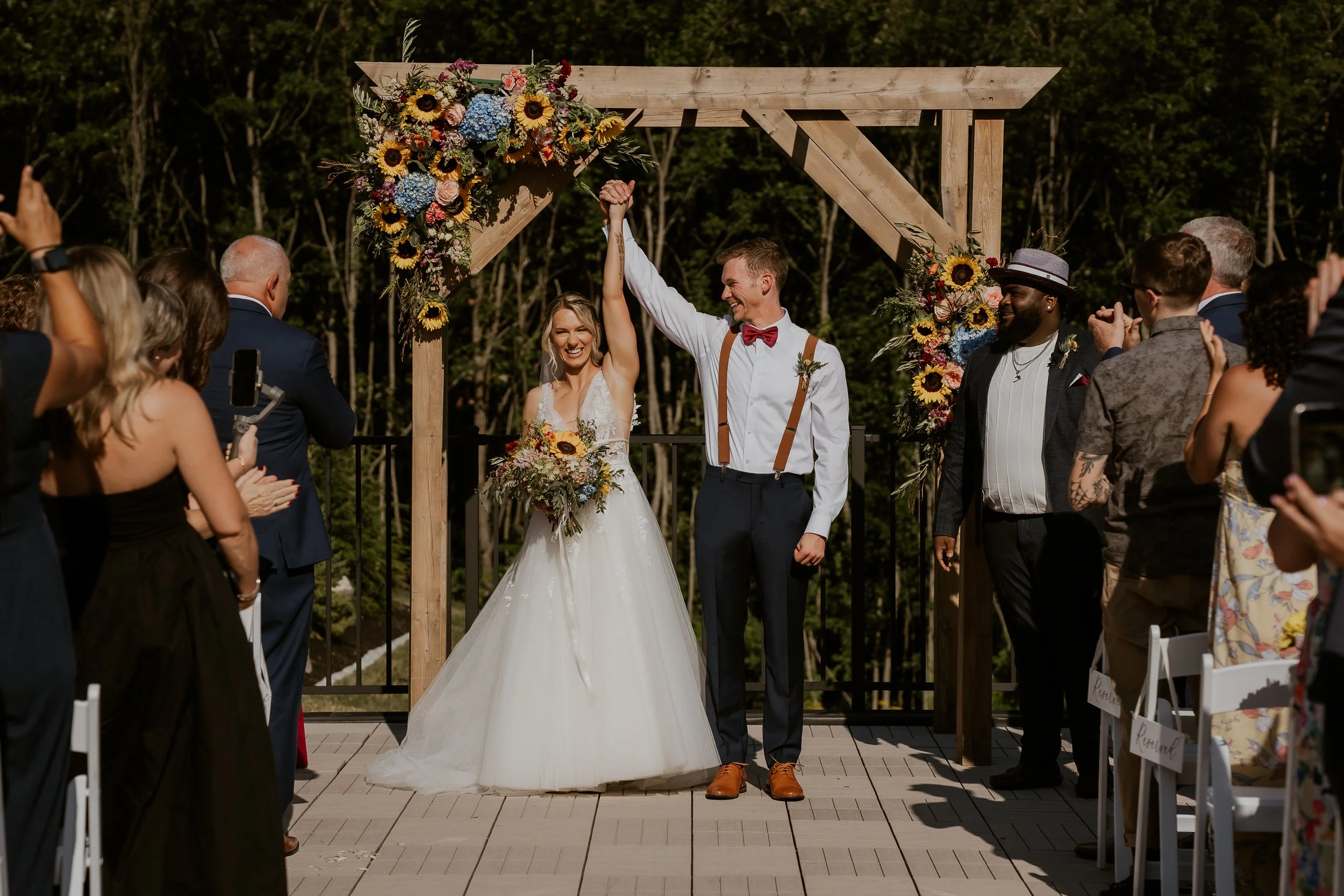 Wedding ceremony located on the Roof Top Deck - guests facing the back woods.