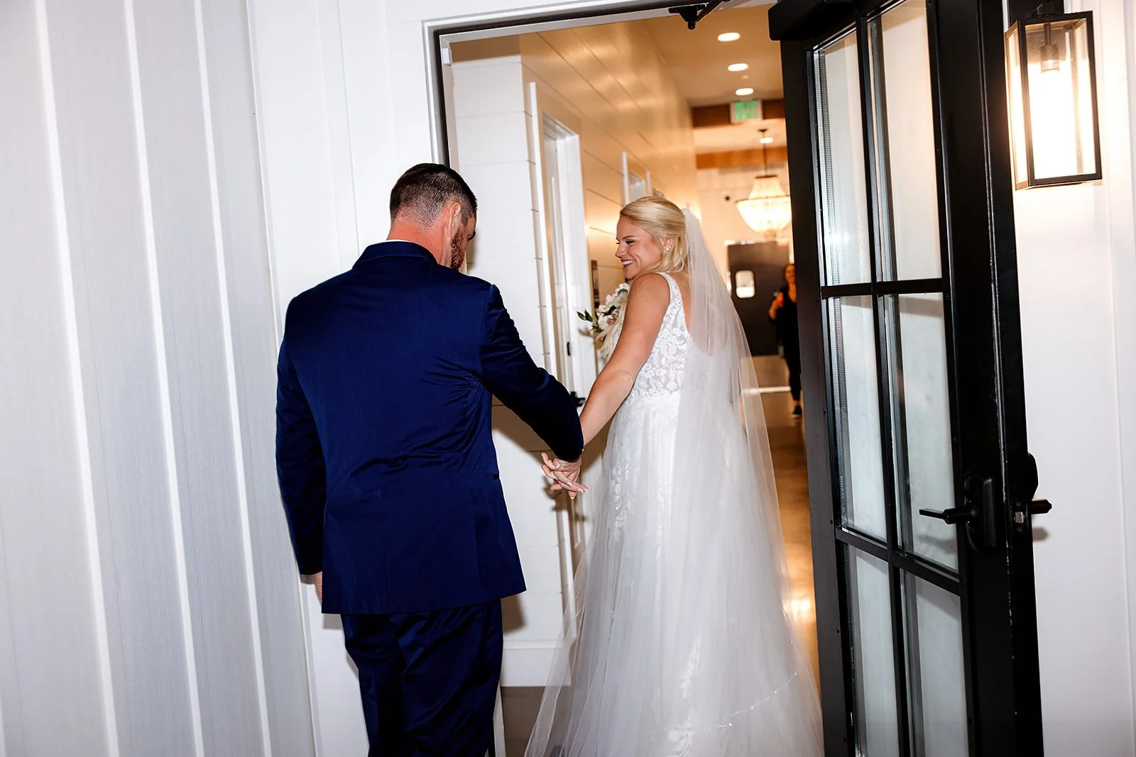 End of ceremony under the Covered Breezeway facing the breezeway door and processional entrance and exit. 