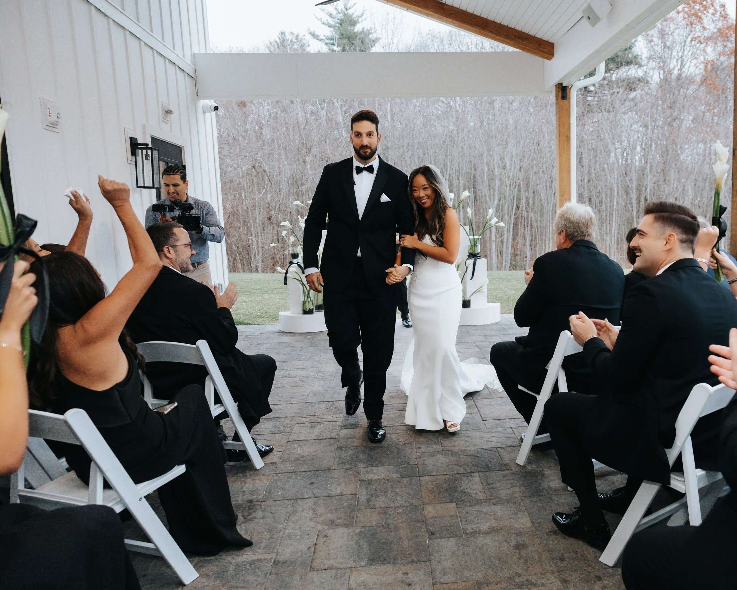 End of wedding ceremony located under the Long Covered Porch. 