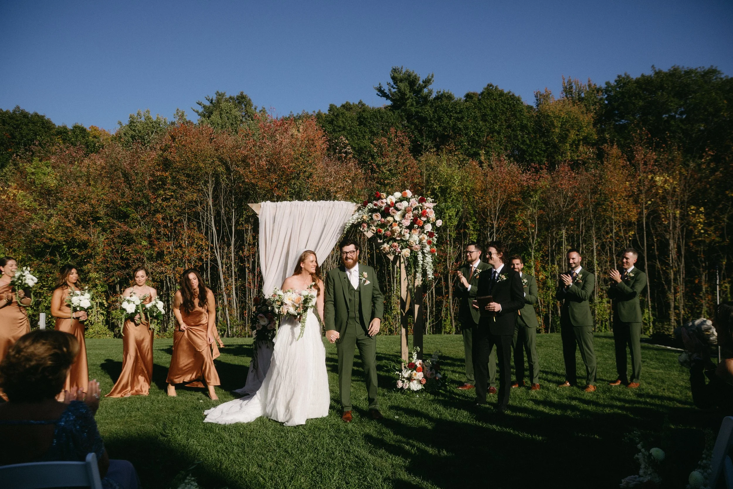 Wedding ceremony on the Middle Lawn facing the back woods. 
