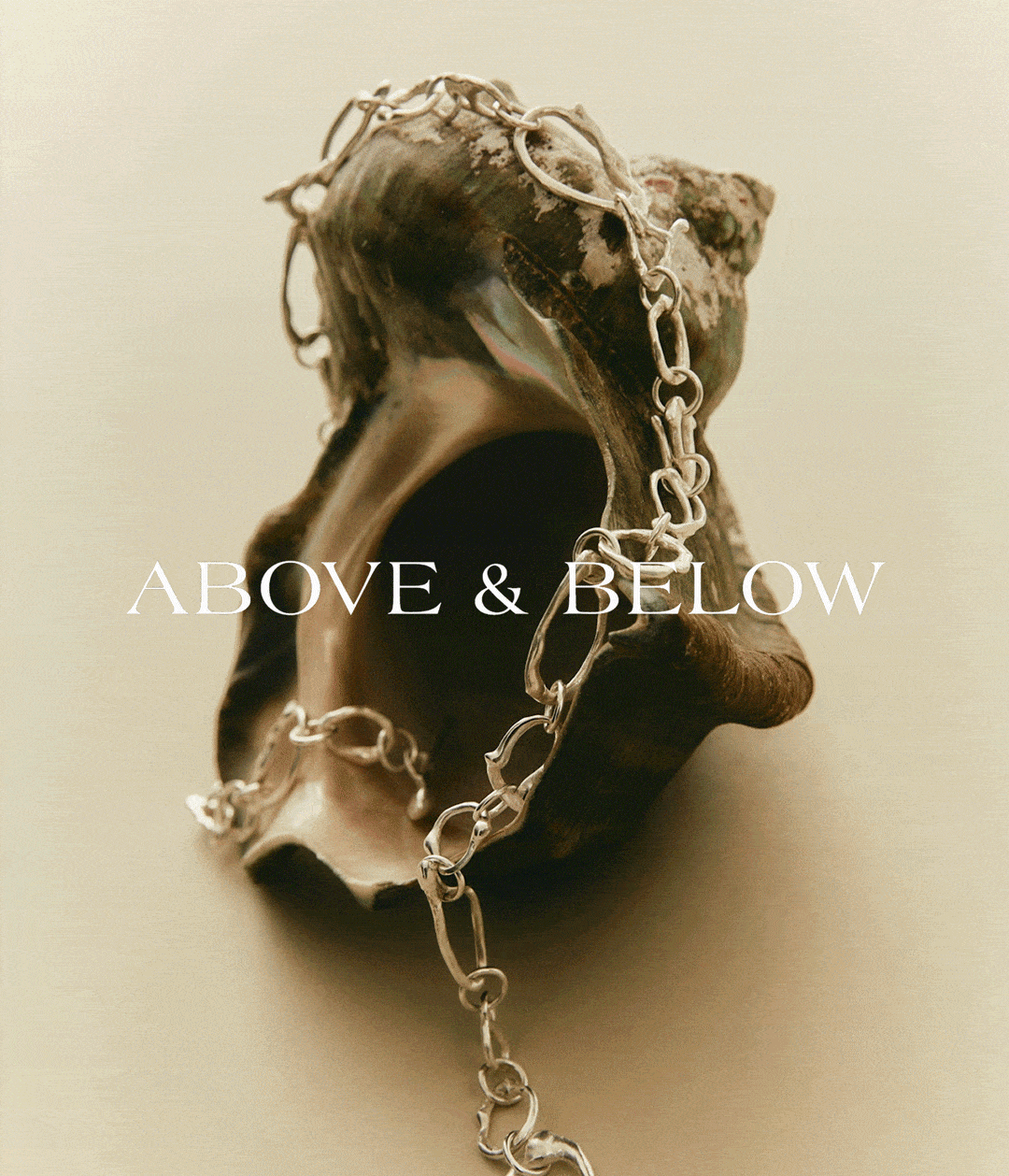 Four stacked dark blue boxes, one with the words 'Above & Below' on the lid.