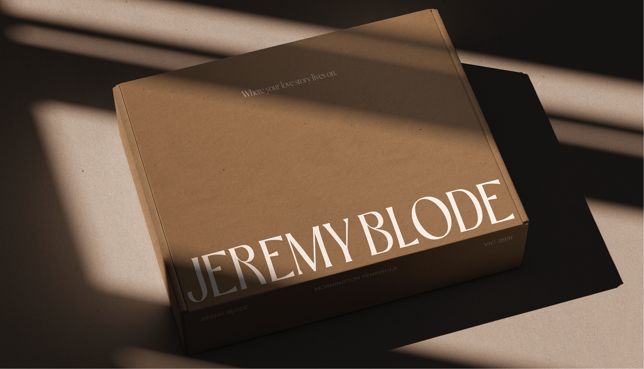 Brown book titled "Jeremy Blode" with the subtitle "Mornington Peninsula" on a surface with shadows cast across it.
