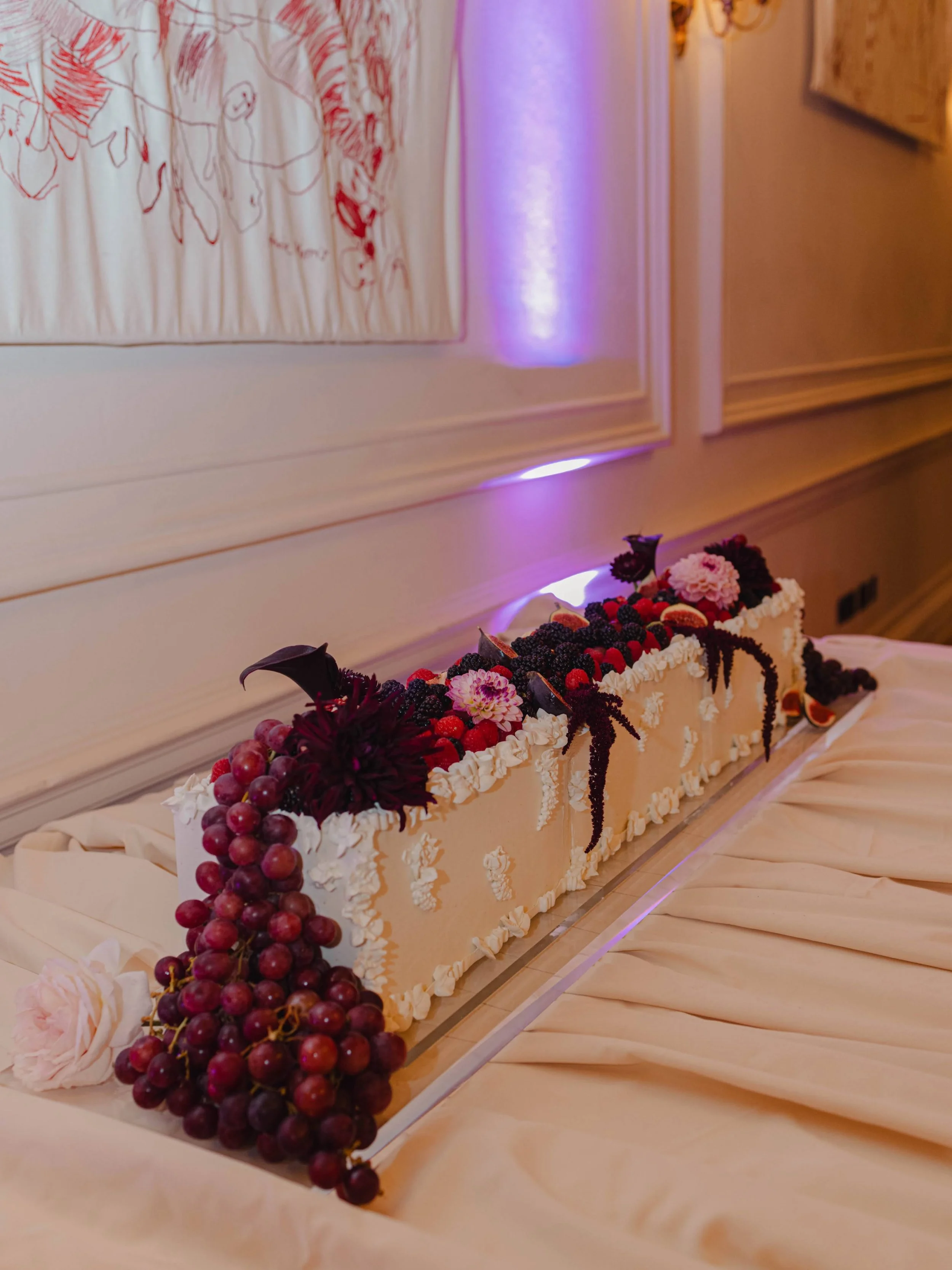 One meter cake for Claire &amp; Chris at The Ned.
Three flavours, a whole lots of grapes, berries and flowers, and even more piped details.  I even styled the table myself because I truly believe every cake deserves the full treatment.
It was such a 