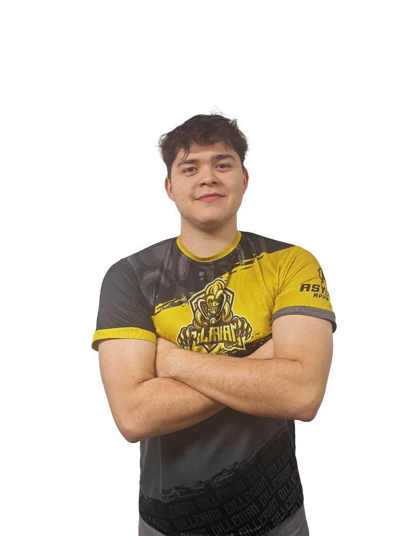 A soldier in uniform wearing a helmet with a headset, arms crossed, looking serious and confident.