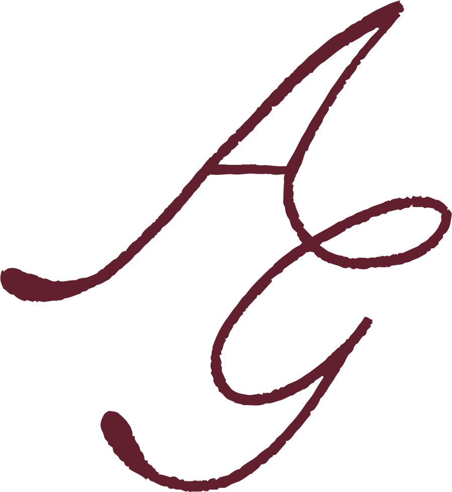 Elegant cursive letter 'E' in dark burgundy color on a black background.