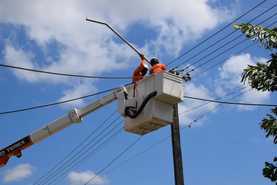 "EBS team lifting and installing Wacapou hardwood beam for utility pole in Suriname"