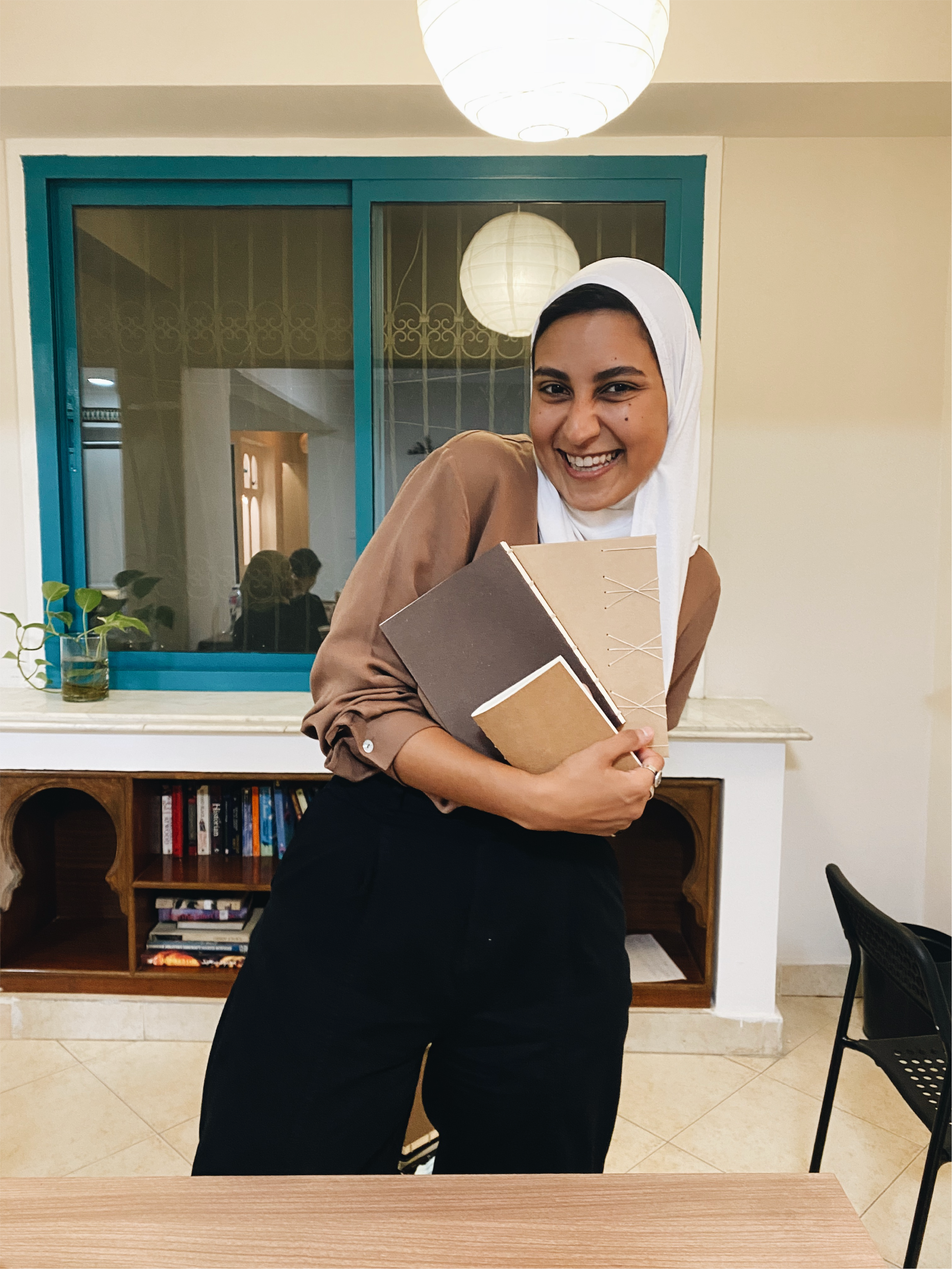 A happy student after finishing her 3 books  