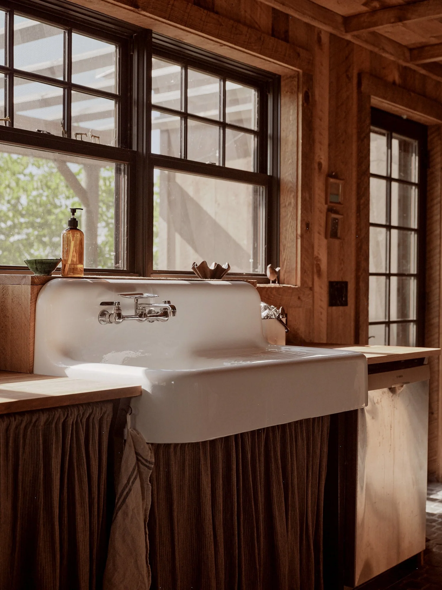 The sink, the window, and the hill beyond