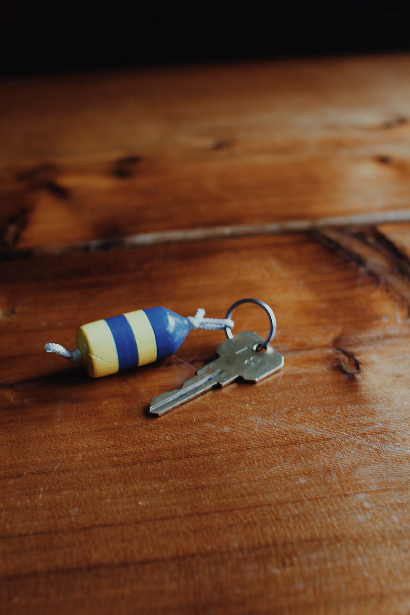 room key with buoy keychain