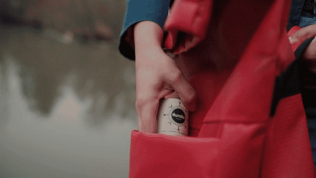 GIF of a woman in the outdoors smelling plastic free deodorant