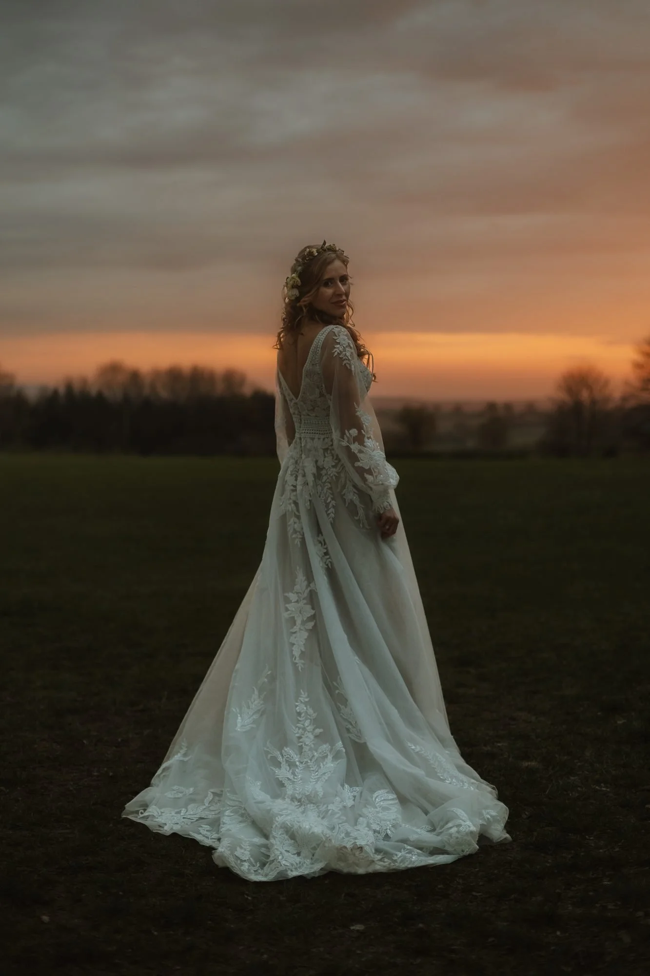 Bride in a lace gown at sunset in a Dorset garden, photographed by Oliver Whillock Visuals