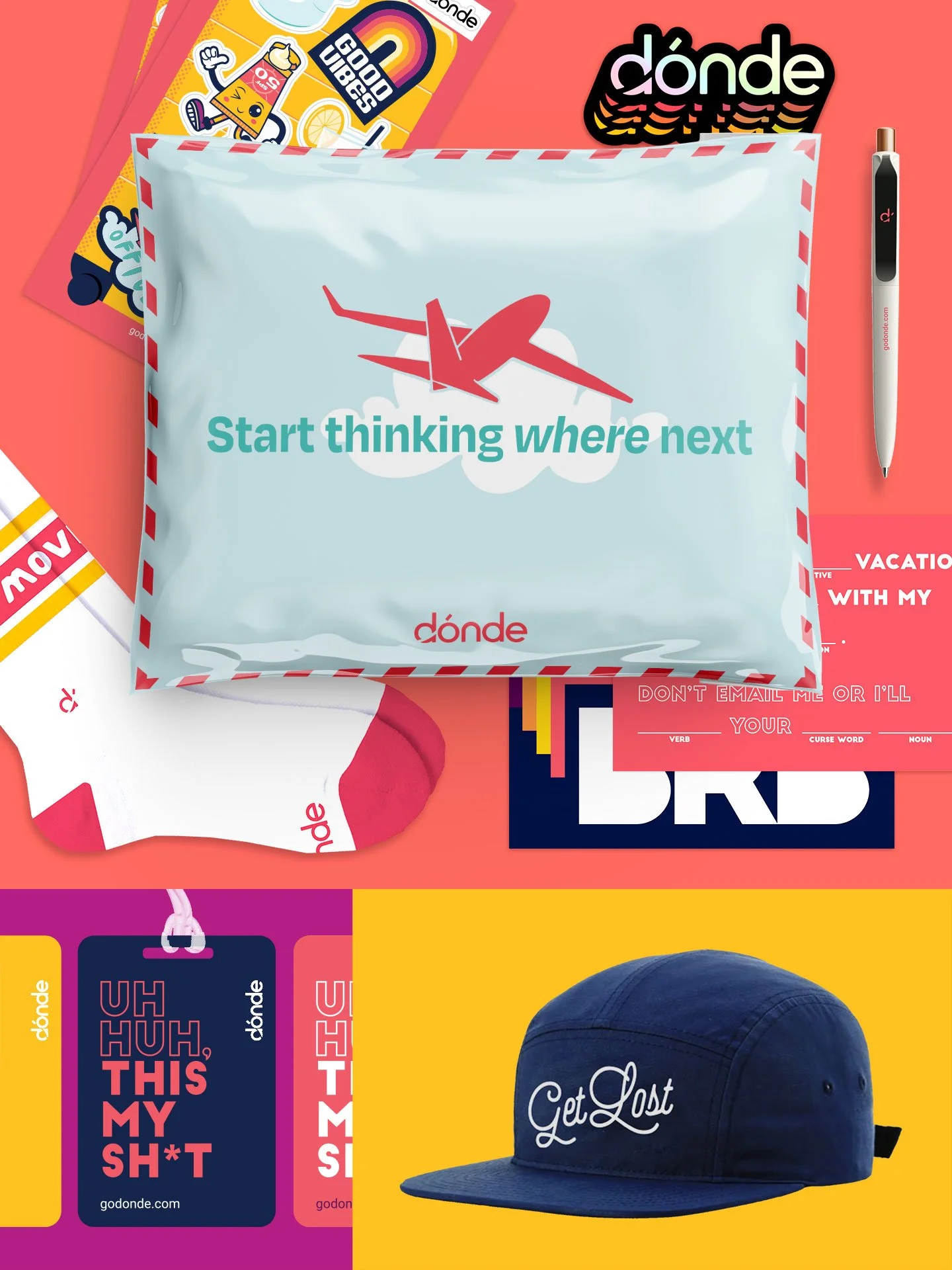 A collection of colorful promotional items from the brand donde, including a white pillow with a red airplane illustration and the message 'Start thinking where next,' a black pen, a blue cap with 'Get Lost' embroidered on it, and various stickers an