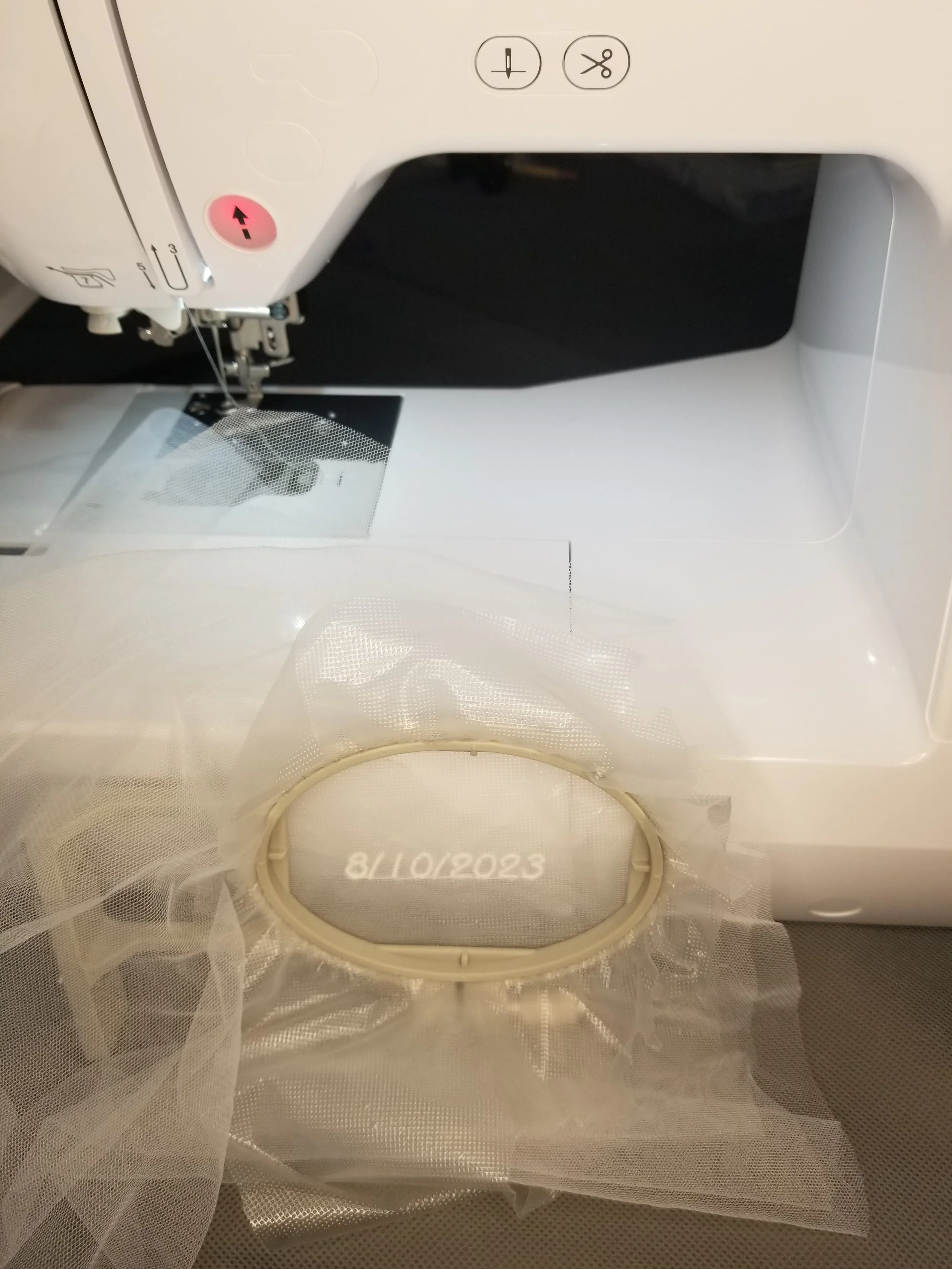 Custom Embroidery wedding date on ivory mesh.