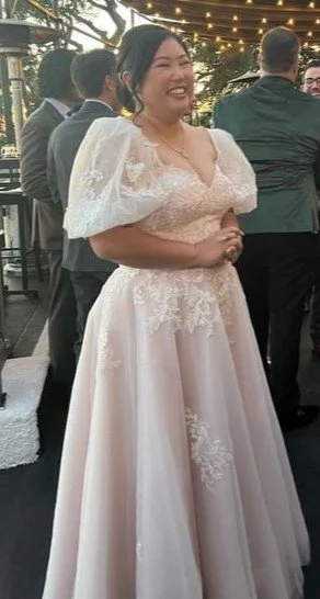 Asian American bride in her Ivoery wedding gown.