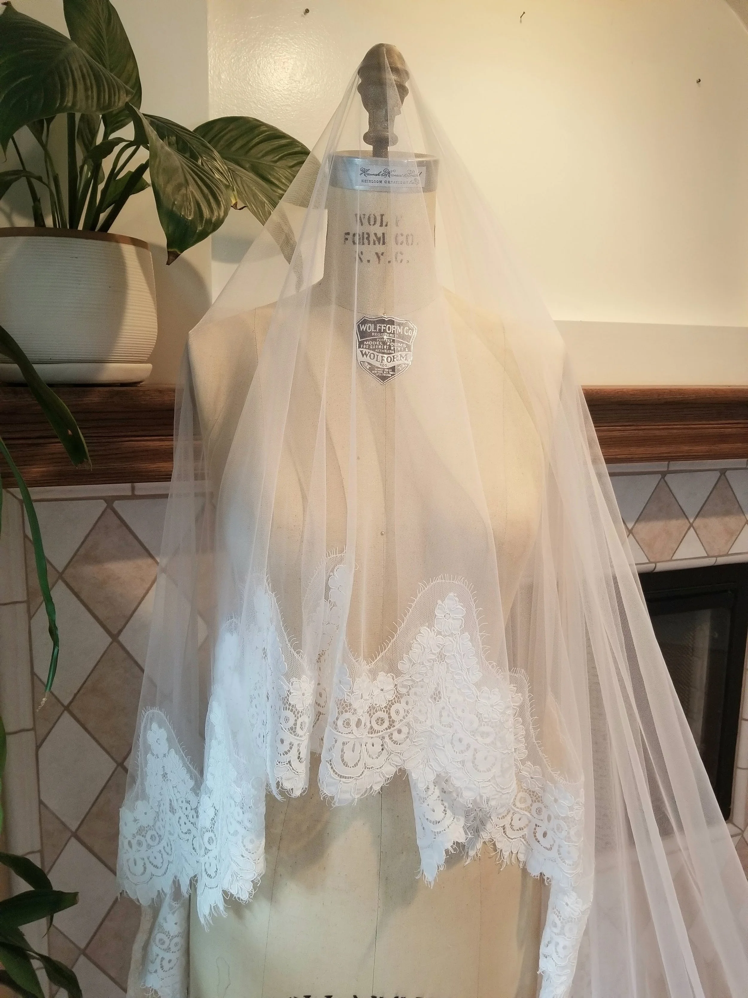 Dropped down cathedral mantilla wedding veil