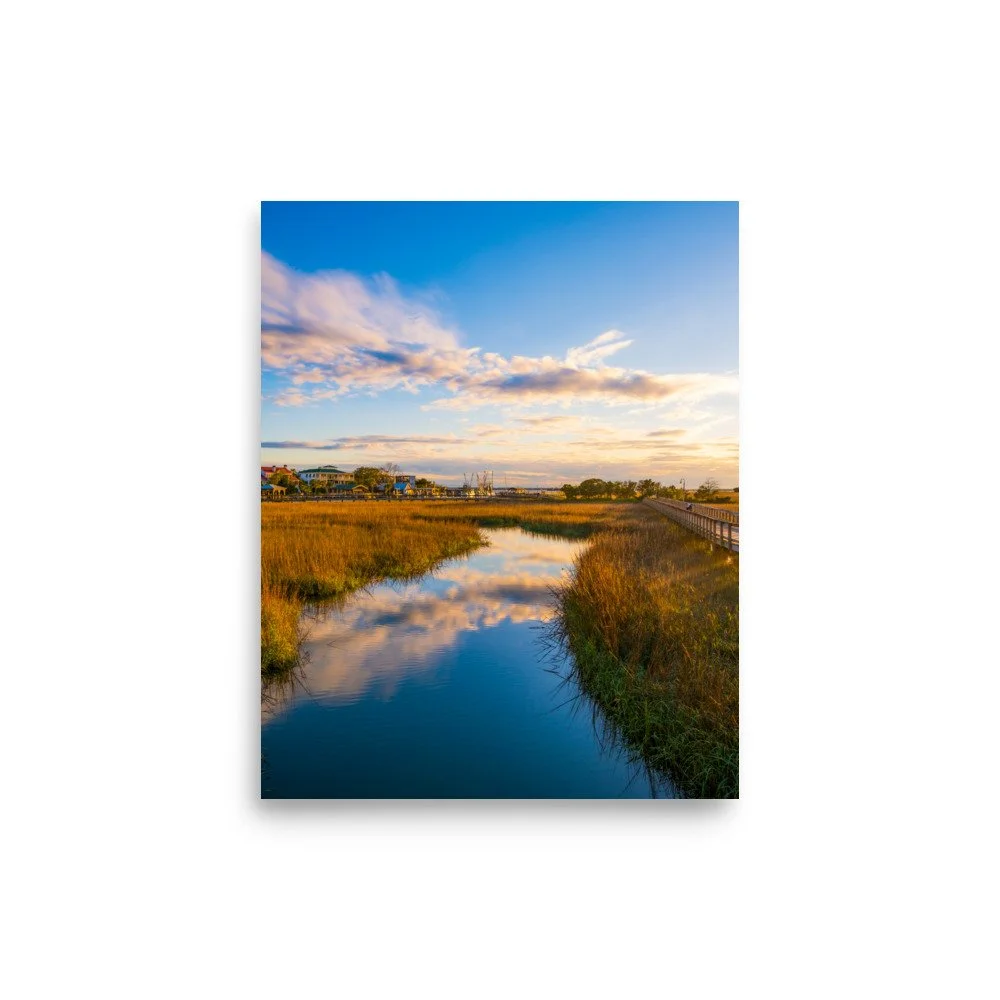 Shem Creek at sunrise with golden light reflecting on calm water - fine art photography print by Palm Social
