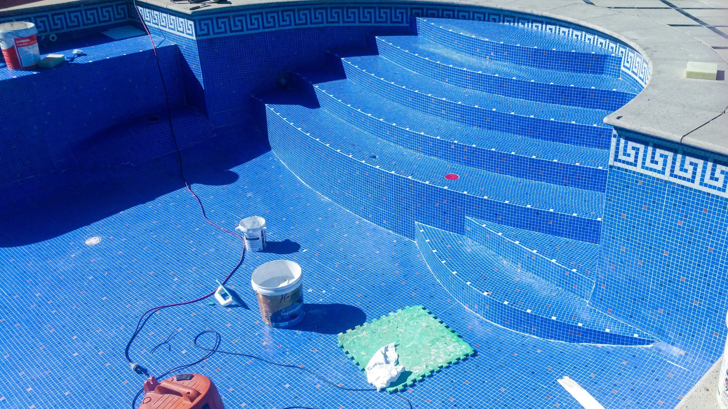 Oranssi technician working on a roof project