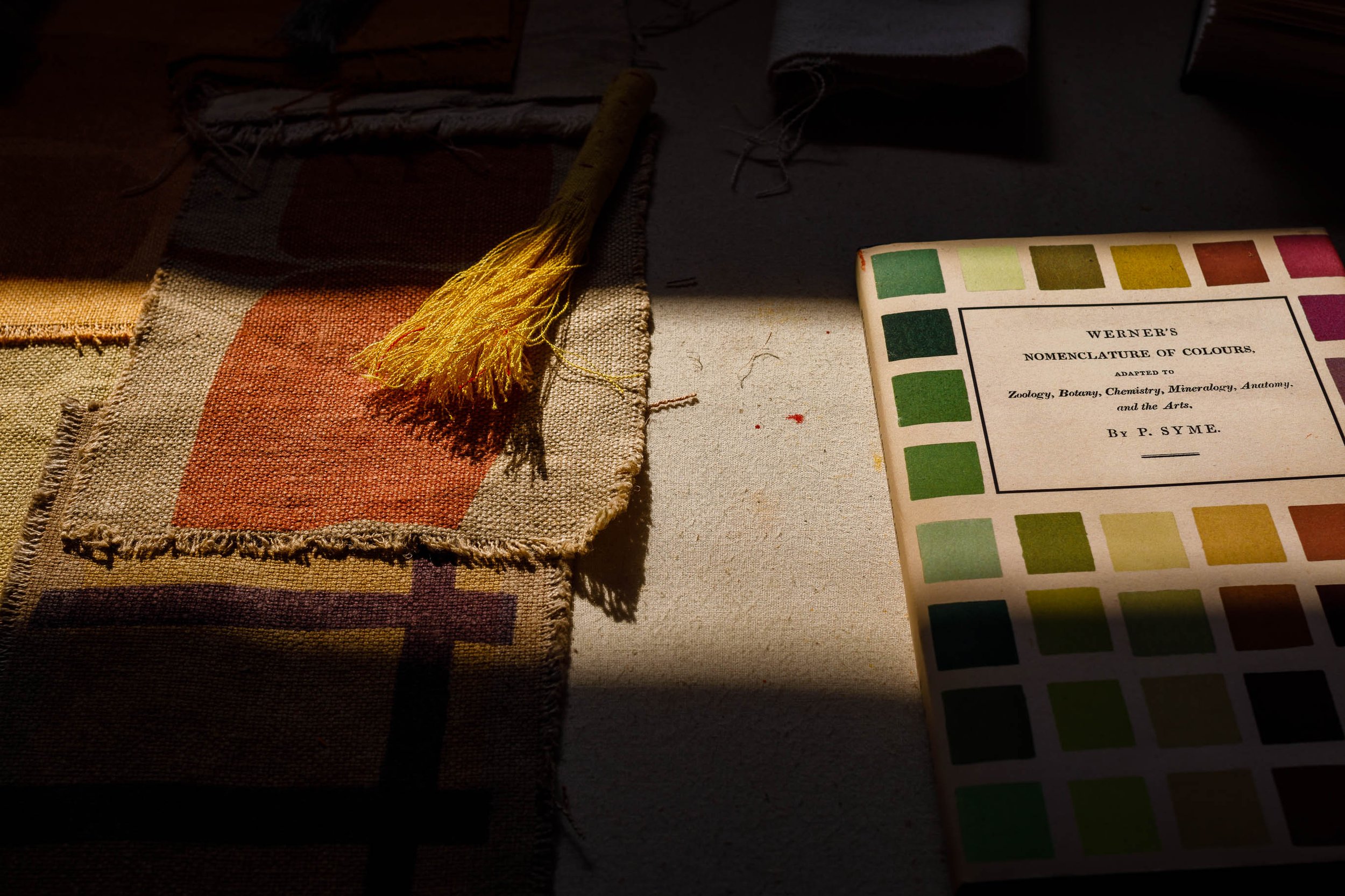 Colours of home swatch book, made in community workshops. 