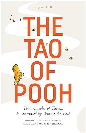 Book cover titled 'The Tao of Pooh' by Benjamin Hoff, featuring the character Winnie the Pooh with bees flying around.