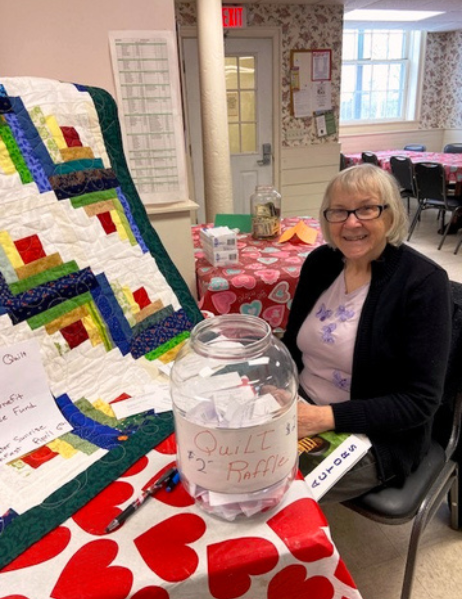 Edna raffling her quilt at the 2026 Easter breakfast