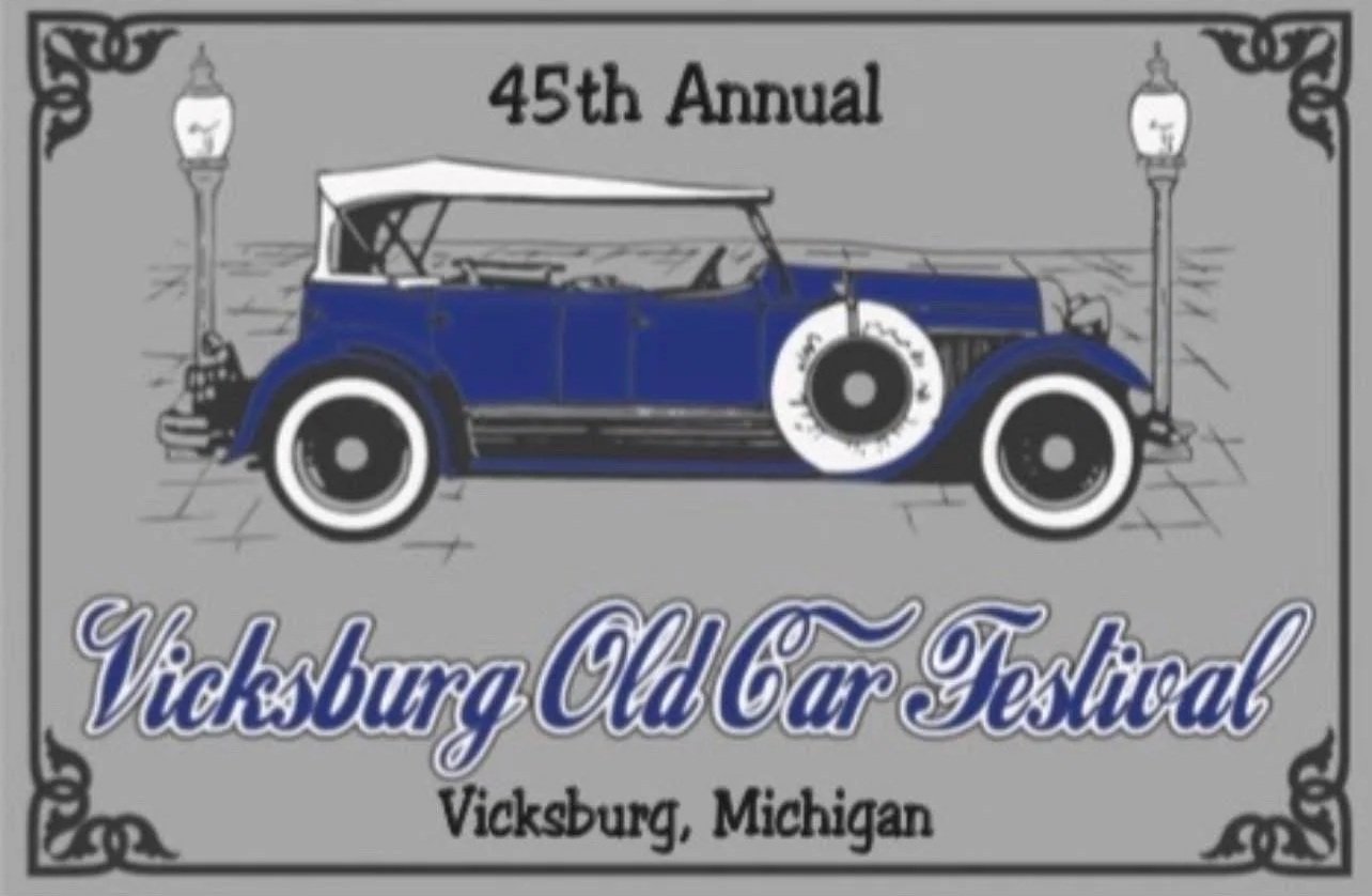Illustration of an antique blue car with white accents, flanked by two street lamps, promoting the 45th annual Vicksburg Old Car Festival in Vicksburg, Michigan.