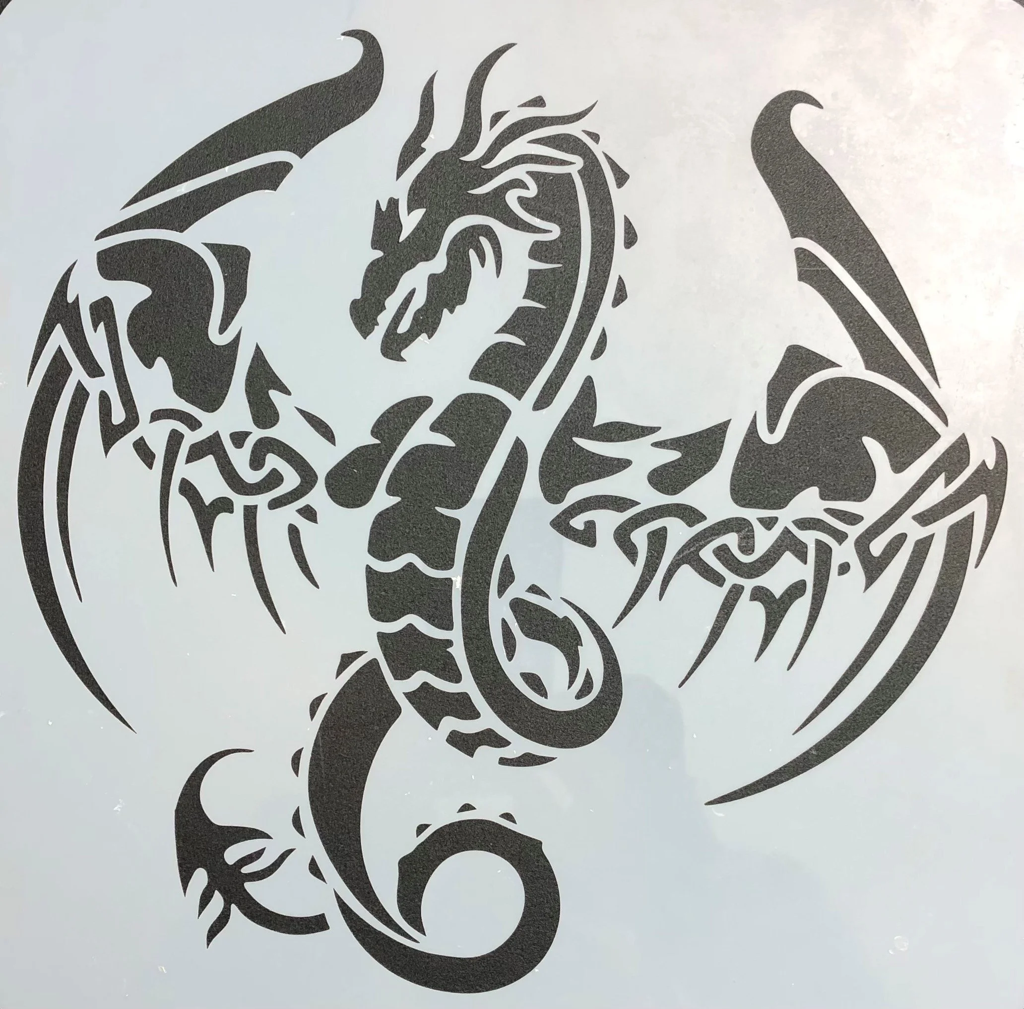 Black and gray dragon and snake tattoo design.